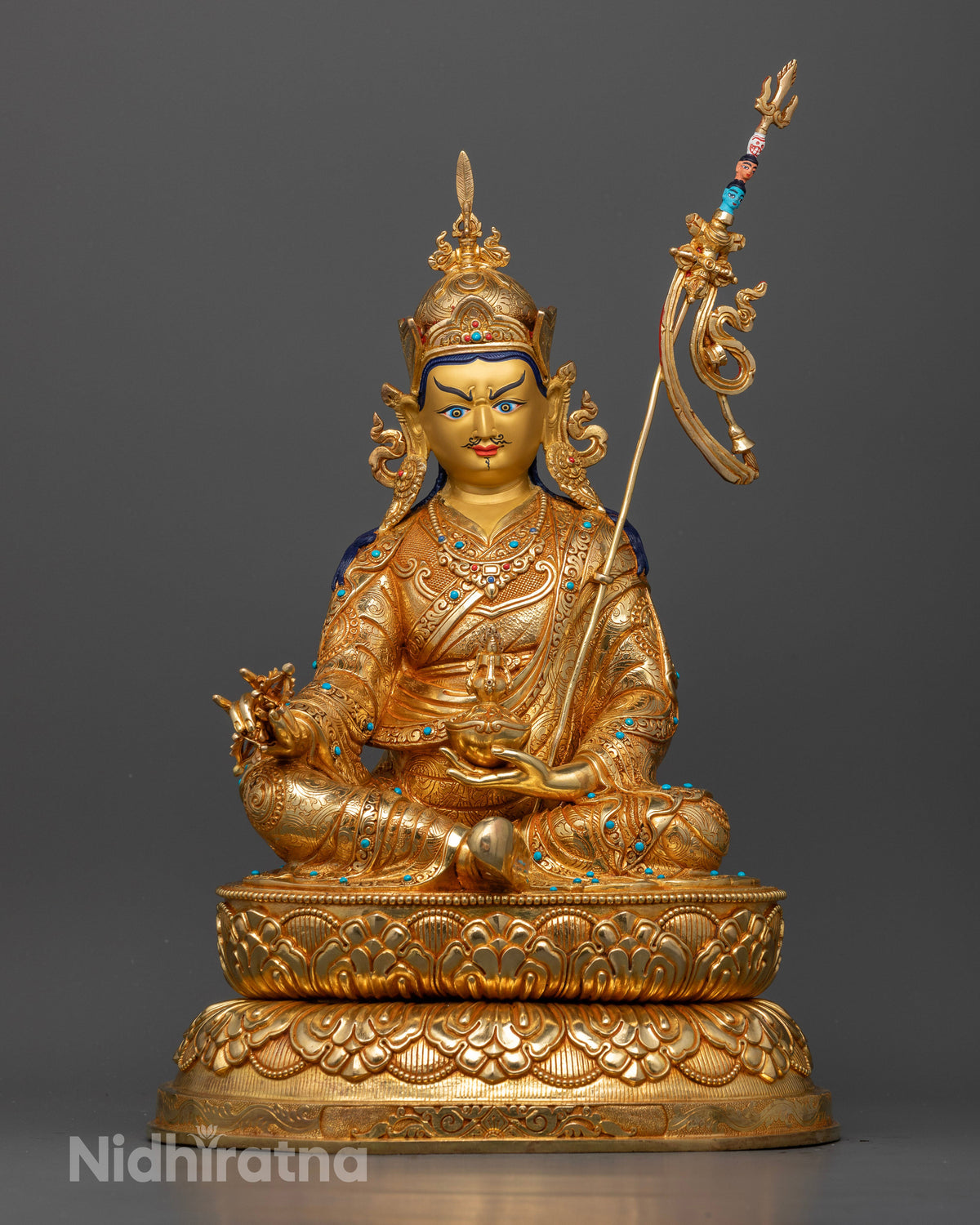 Front view of Guru Rinpoche statue with gold fire-gilding, 24K gold-painted face, and semi-precious stones.