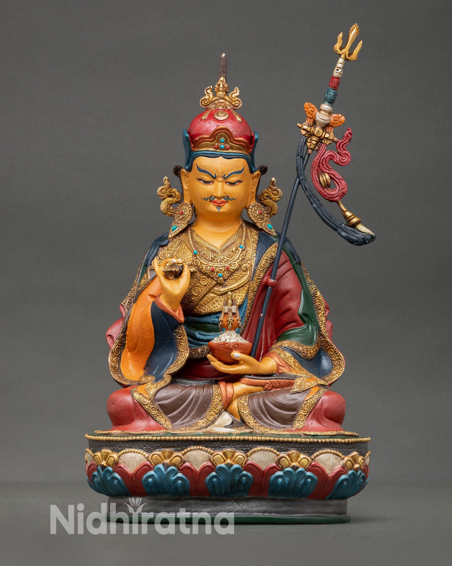 Front view of Guru Tsokye Dorje statue, copper with gold gilding, vajra and kalash