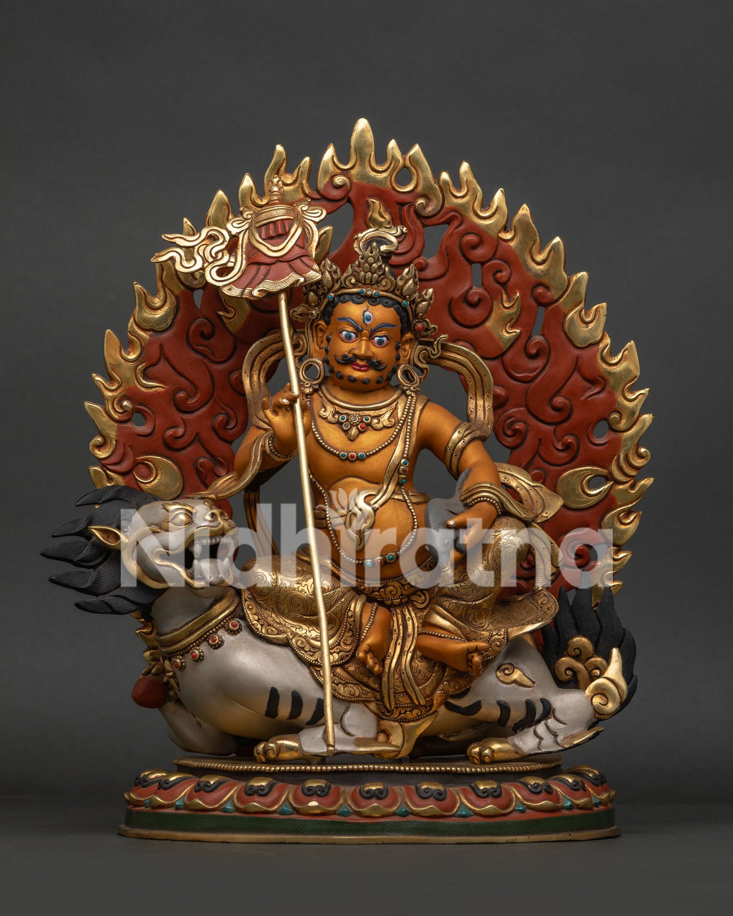 Front view of handcrafted copper and gold-gilded Namtoshe Buddhist statue on snow lion