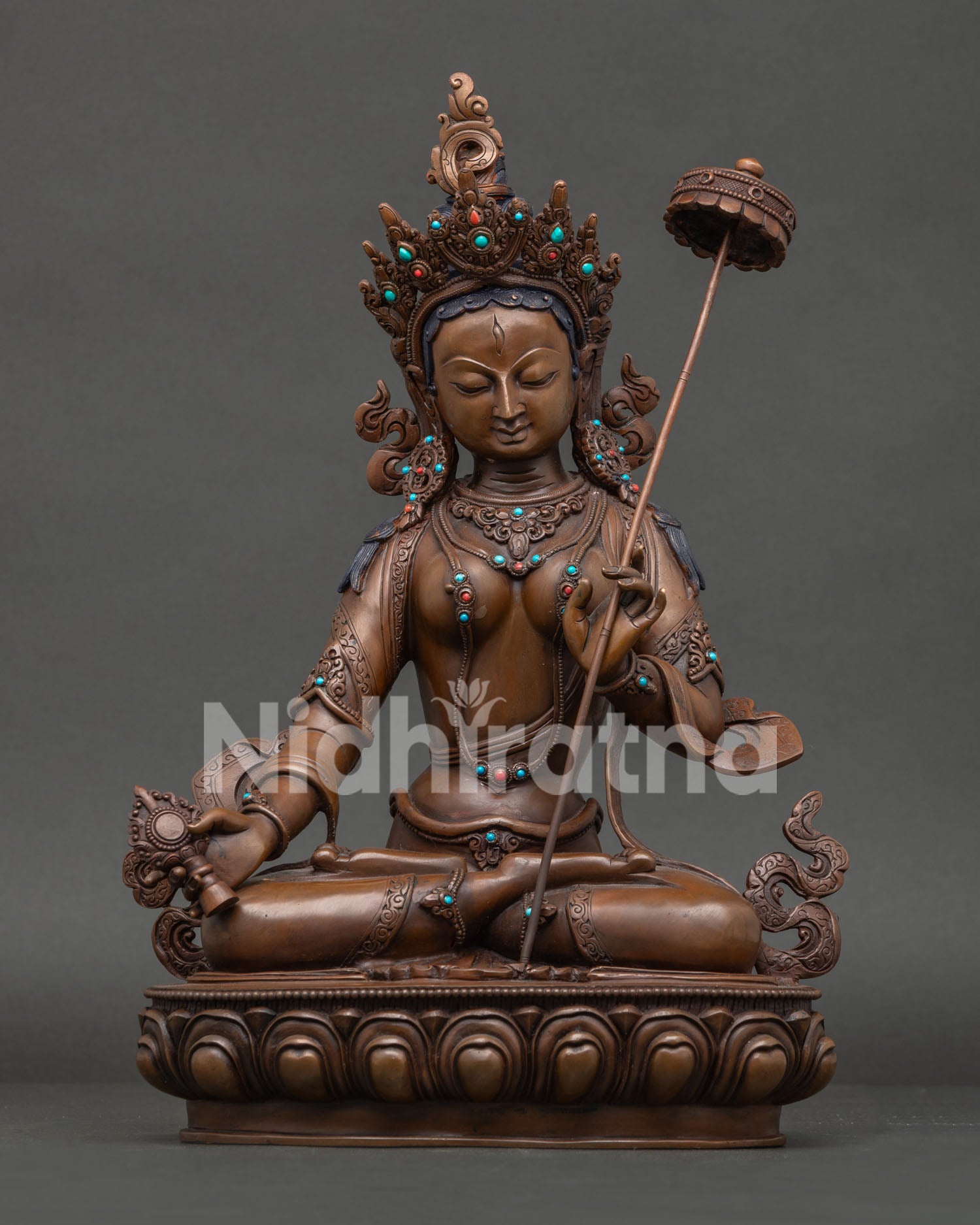 Front view of Handcrafted Dukar statue, Sitatapatra Goddess of Protection with oxidized copper