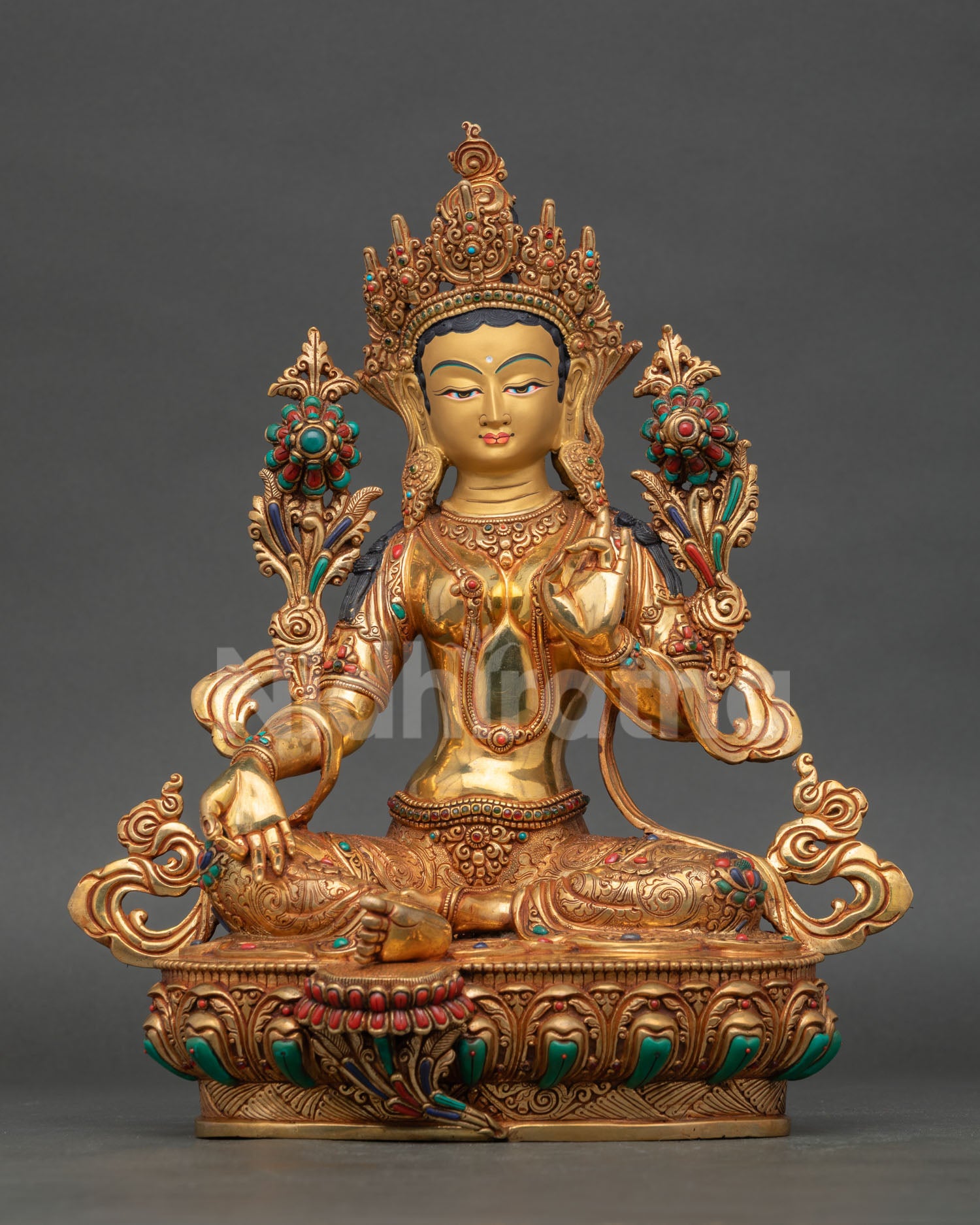 Front view of handcrafted Green Tara statue, made in Nepal, using lost wax casting with 24K gold gilding copper finish and semi-precious stone decoration