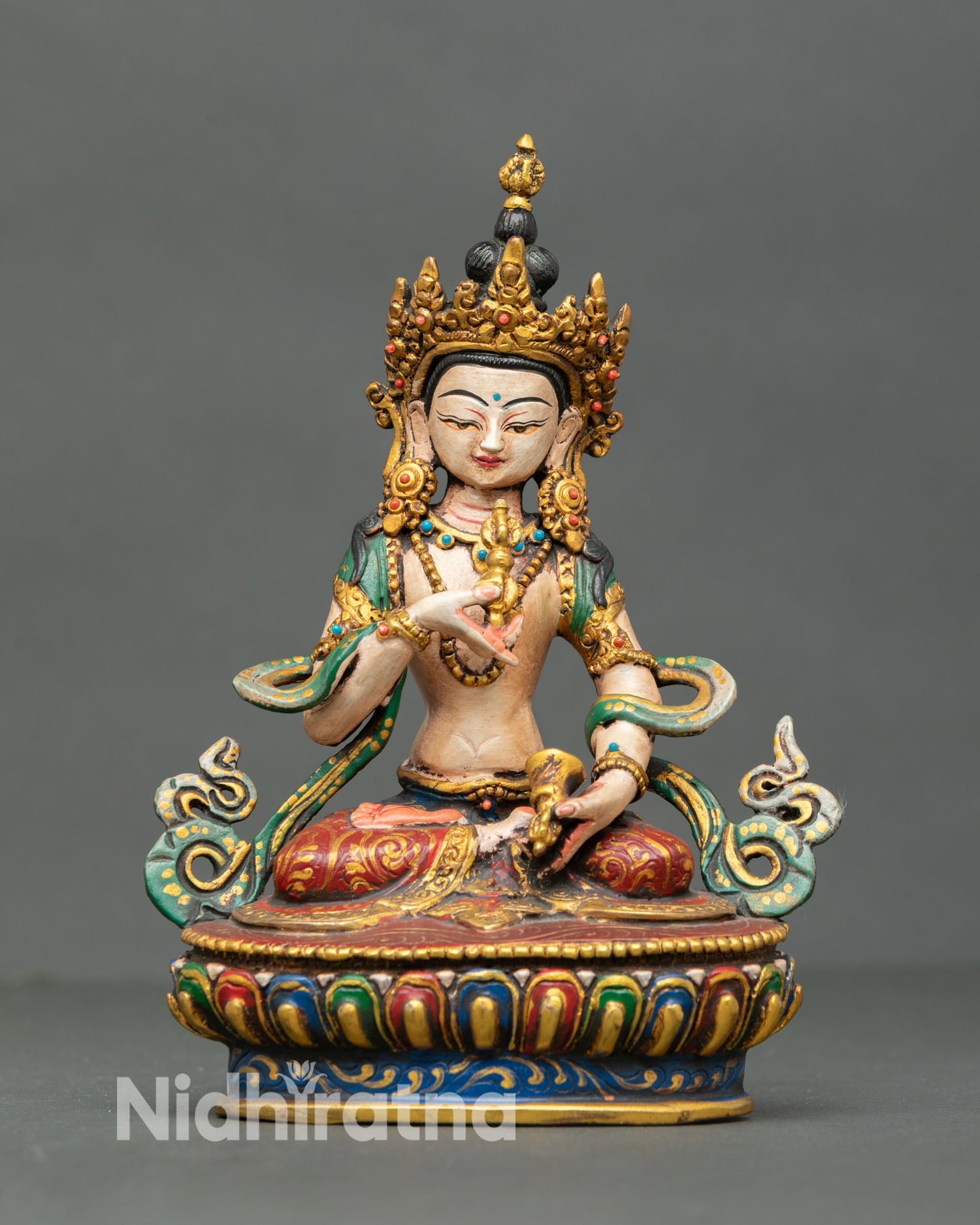 Front view of handcrafted Vajrasattva statue from Nepal made in copper with hand painted acrylic finish and semi precious stones symbolizing purification karma cleansing