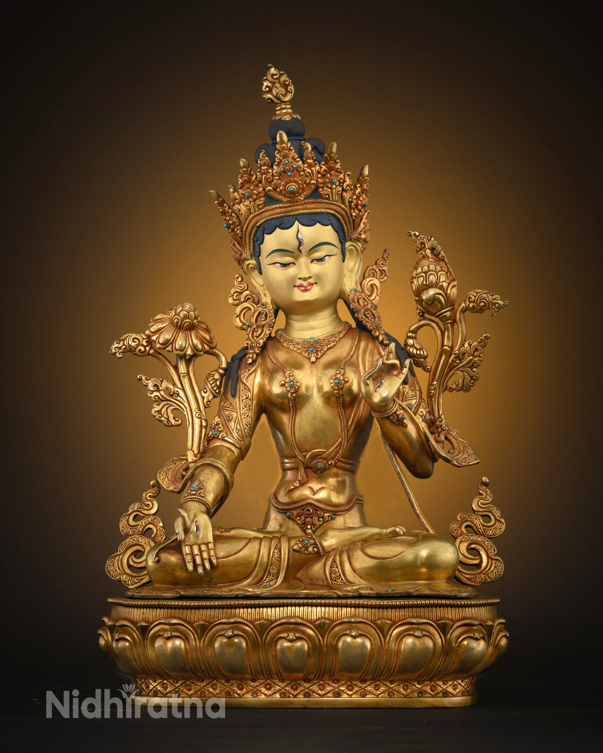 Front view of handcrafted White Tara Buddhist statue in 24K fire-gilded copper on lotus base