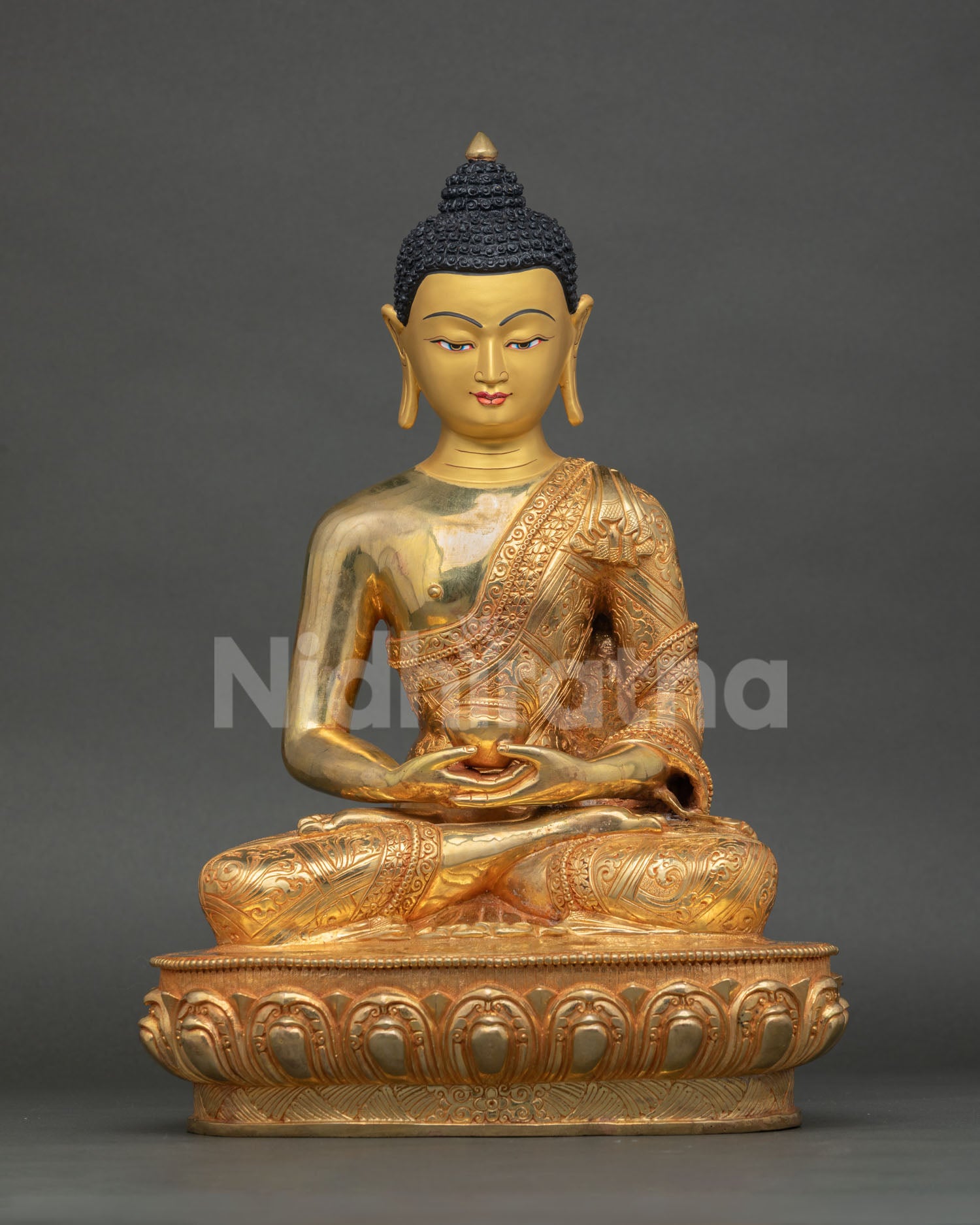 Front view of a handmade Amitabha Buddha statue from Nepal in copper and 24K gold gilding with a lotus pedestal