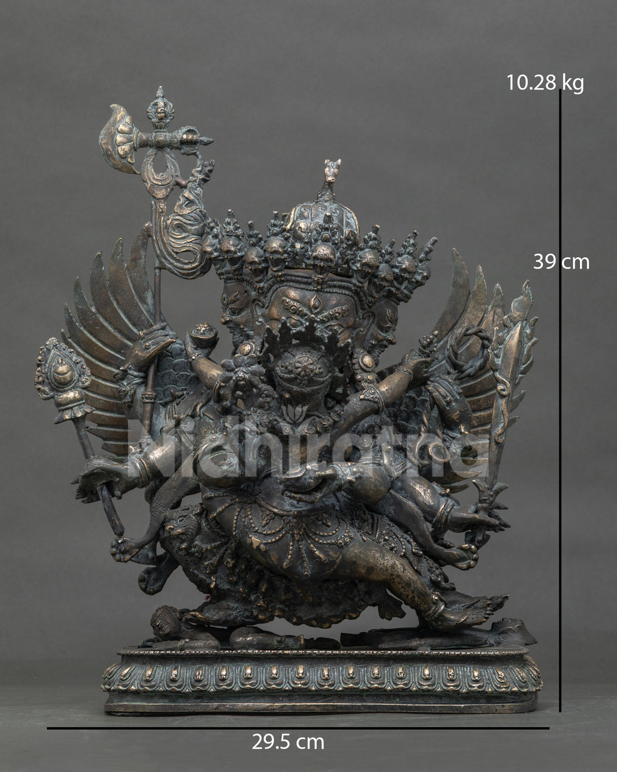 Front view of handmade bronze three-faced Hayagriva statue from Nepal with outspread wings