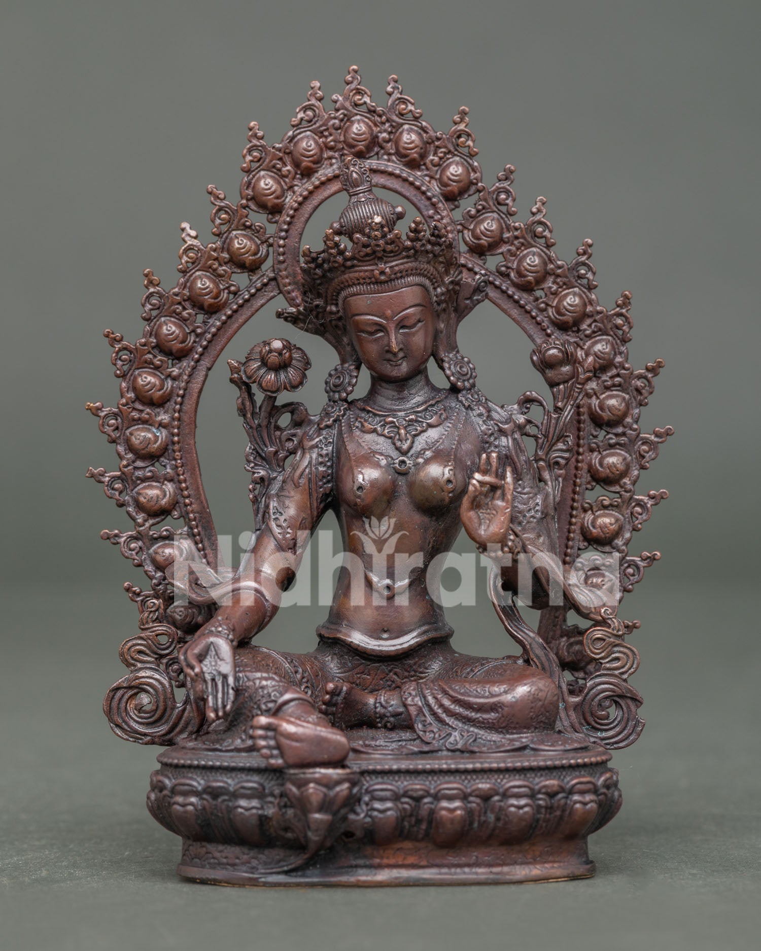 Front view of Handmade Green Tara Statue with oxidized copper finish and floral halo