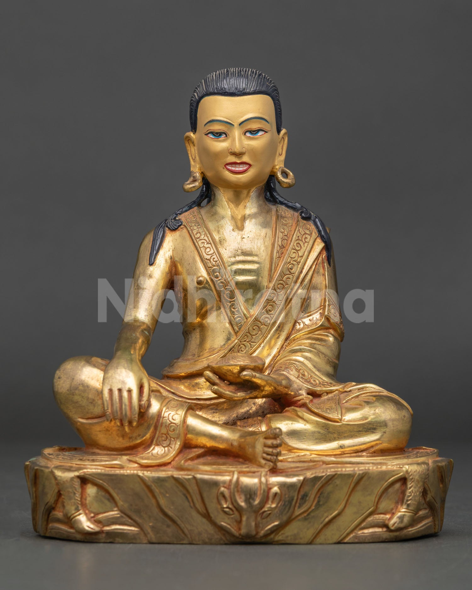Front view of handmade Milarepa statue from Nepal in copper with 24K gold fire gilding