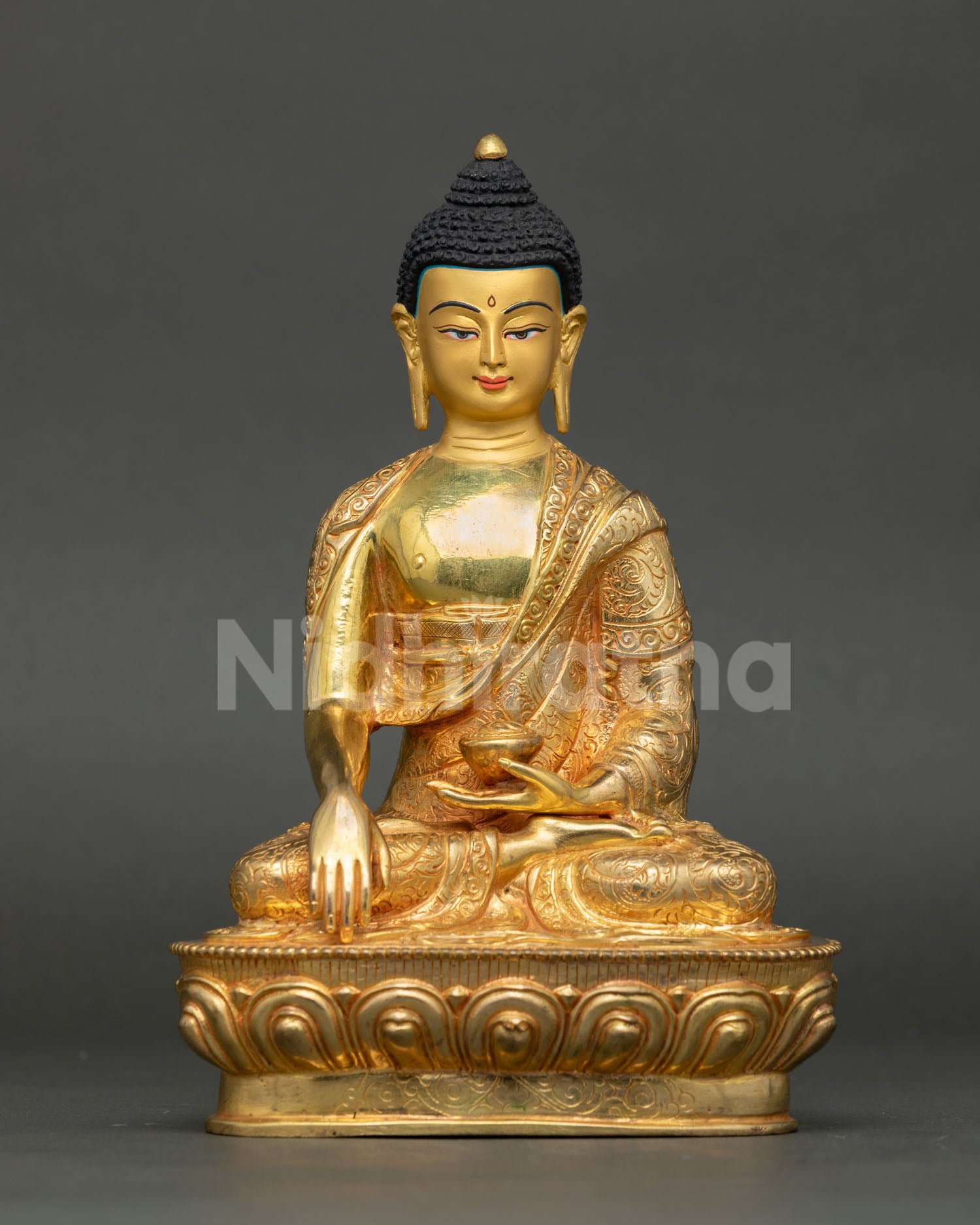 Front view of a handmade Shakyamuni Buddha statue with 24K gold gilding and a lotus pedestal