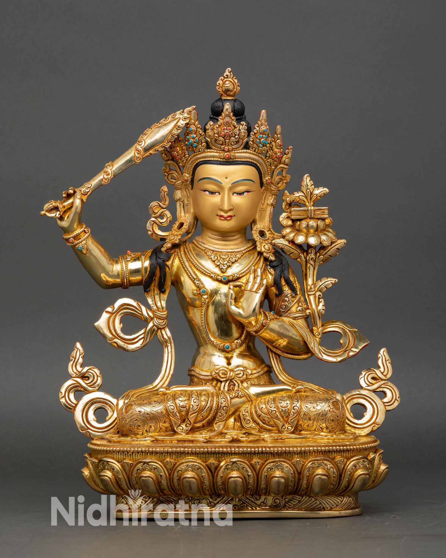 Front view of Manjushri statue copper gold fire-gilded face Nepalese handcrafted meditation decor