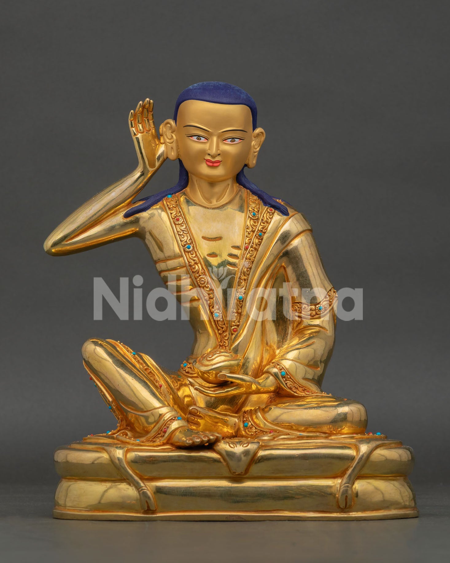 Front view of Milarepa statue, handcrafted in Nepal with 24K gold gilding and turquoise coral stone details