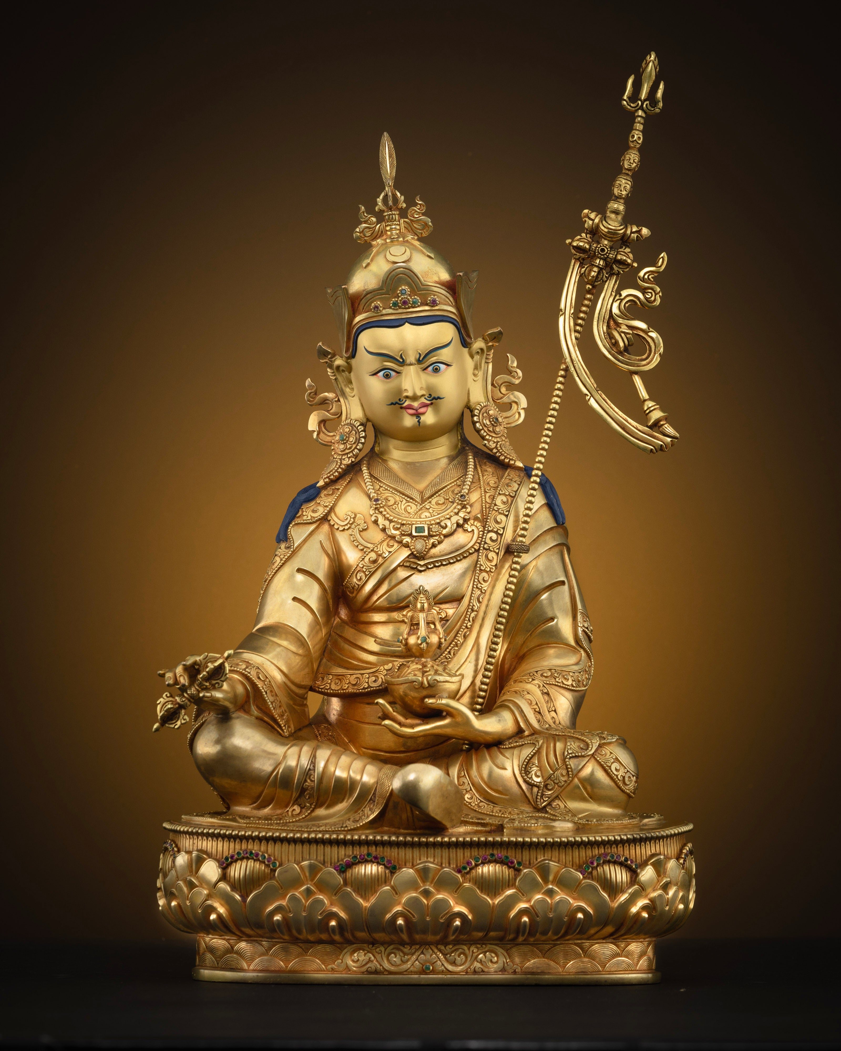 Front view of one of a kind Guru Rinpoche statue with 24K gold gilding and lotus pedestal
