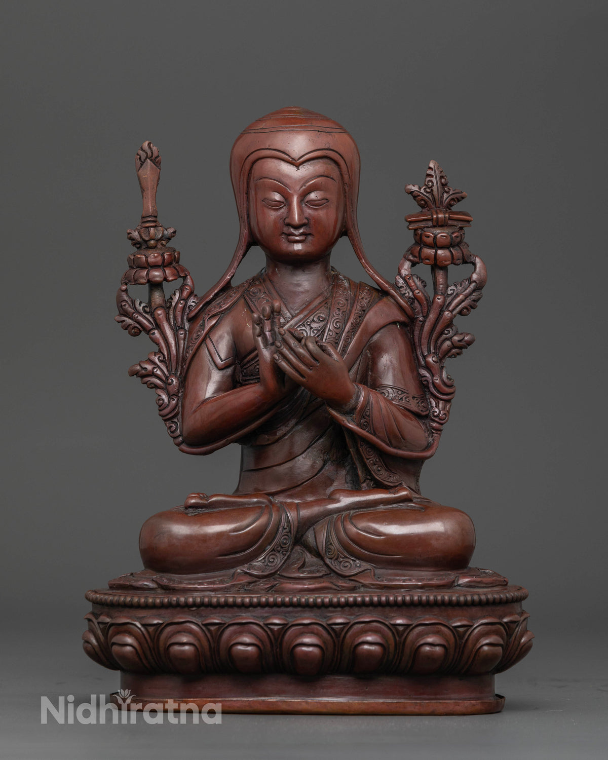 Front view of oxidized copper Tsongkhapa statue with intricate details handcrafted by Nepalese artisans