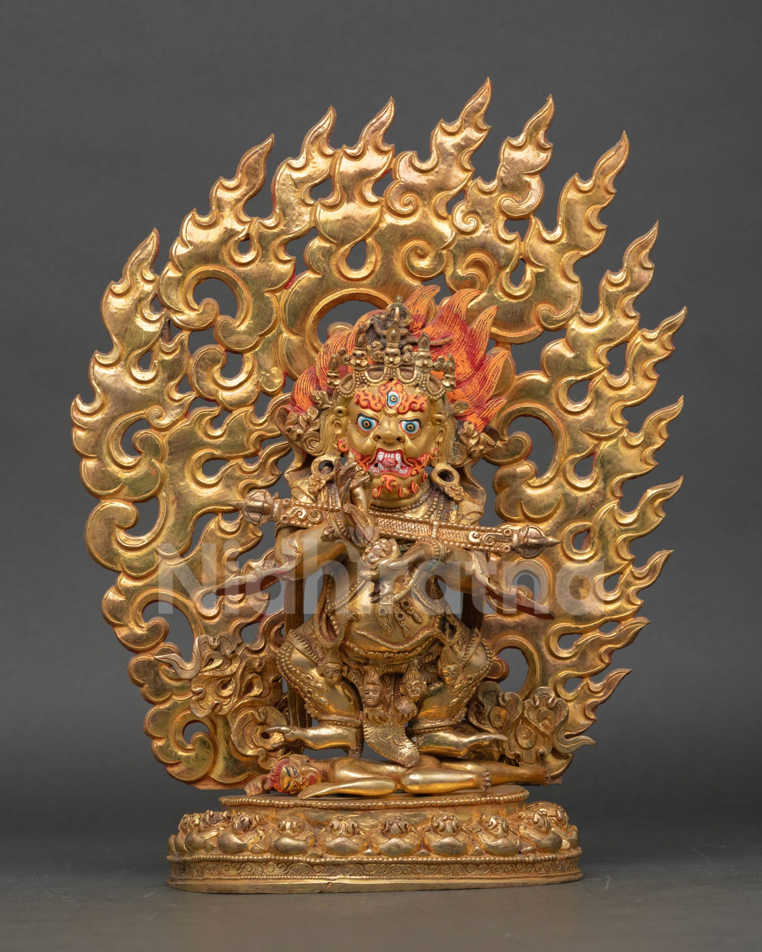 Front view of Sakya Mahakala statue handmade in copper with gold gilding and gold painted face from Nepal