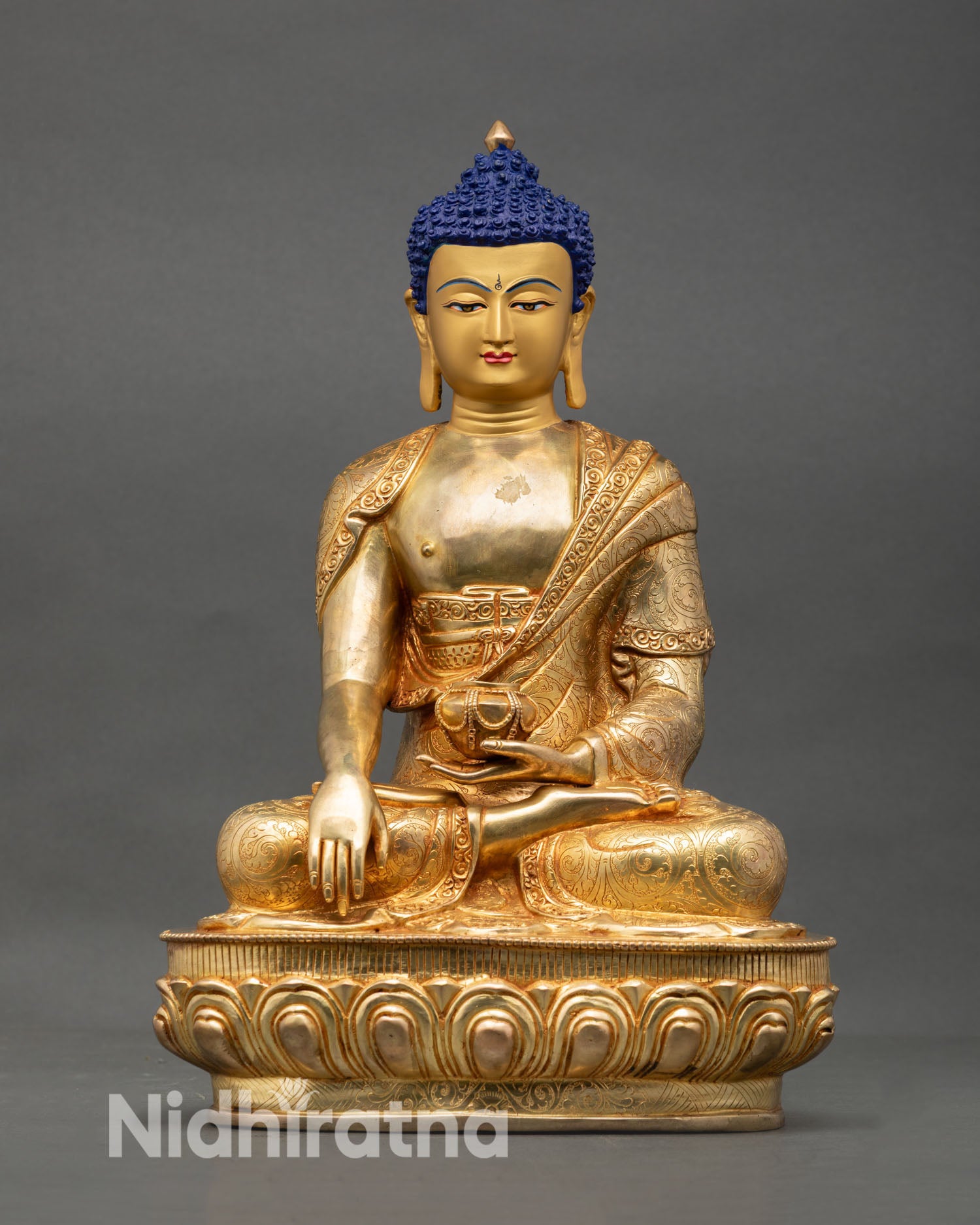 Front view of Shakyamuni Buddha statue handmade Nepal copper with 24K gold fire gilded finish and gold painted face for meditation altar decor