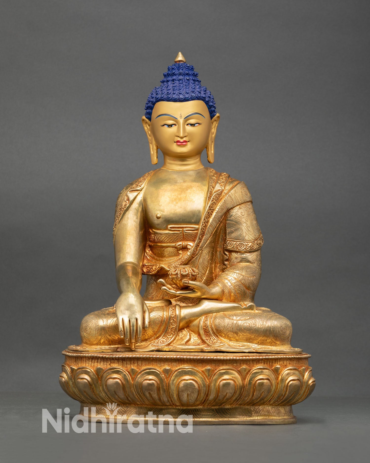 Front view of Shakyamuni Buddha statue handmade Nepal copper with gold gilded details and gold painted face
