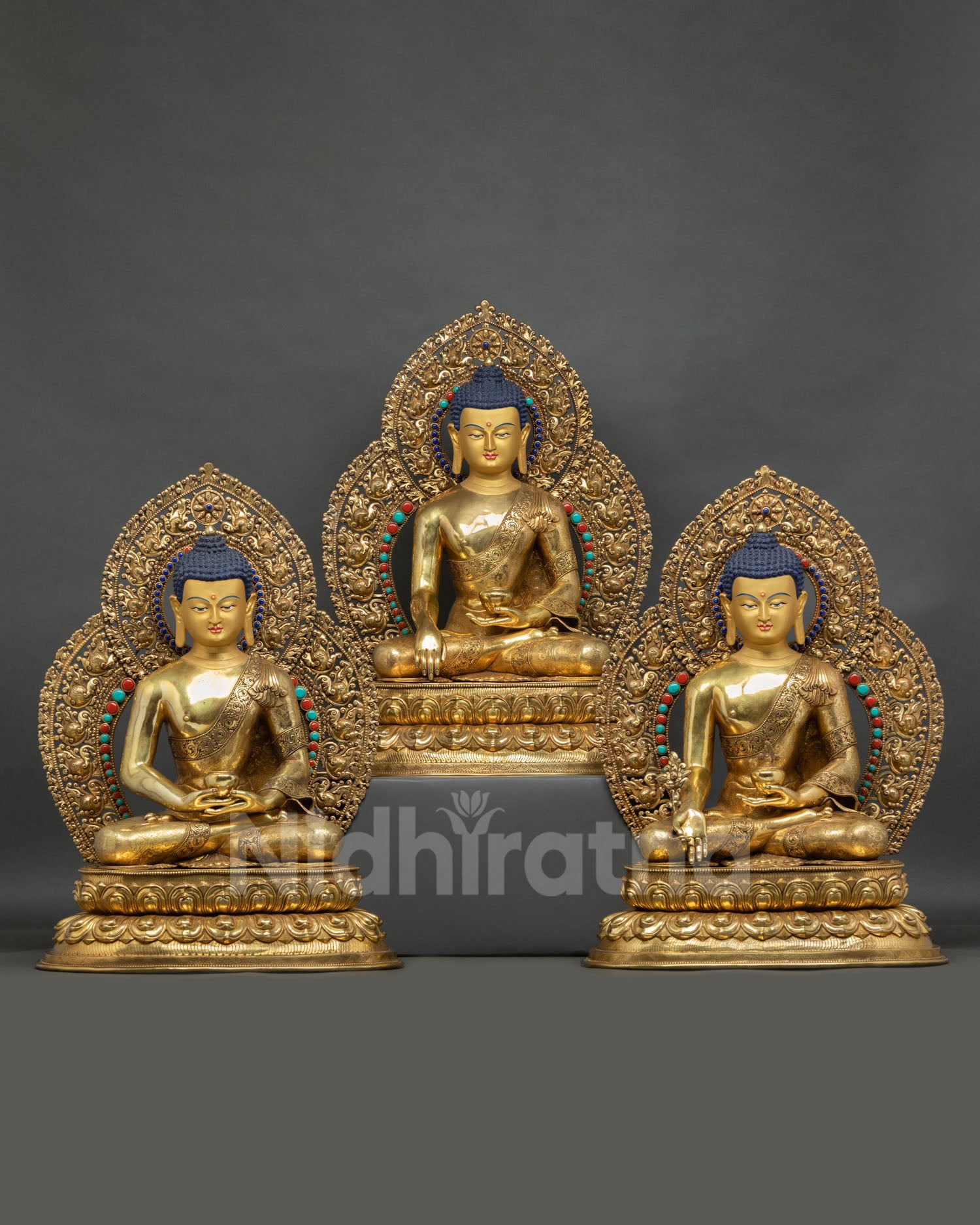 Front view of Three Buddha statue set featuring Shakyamuni Amitabha and Medicine Buddha handcrafted in Nepal in gold fire gilded copper
