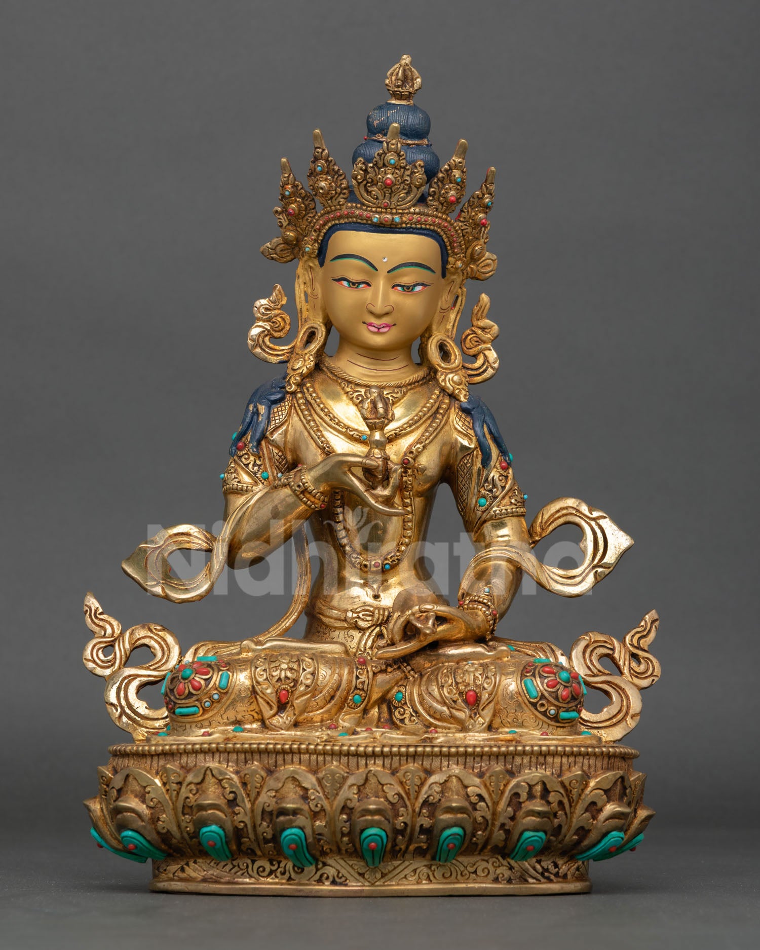Front view of Vajrasattva statue seated on lotus pedestal with gold gilded copper finish from Nepal