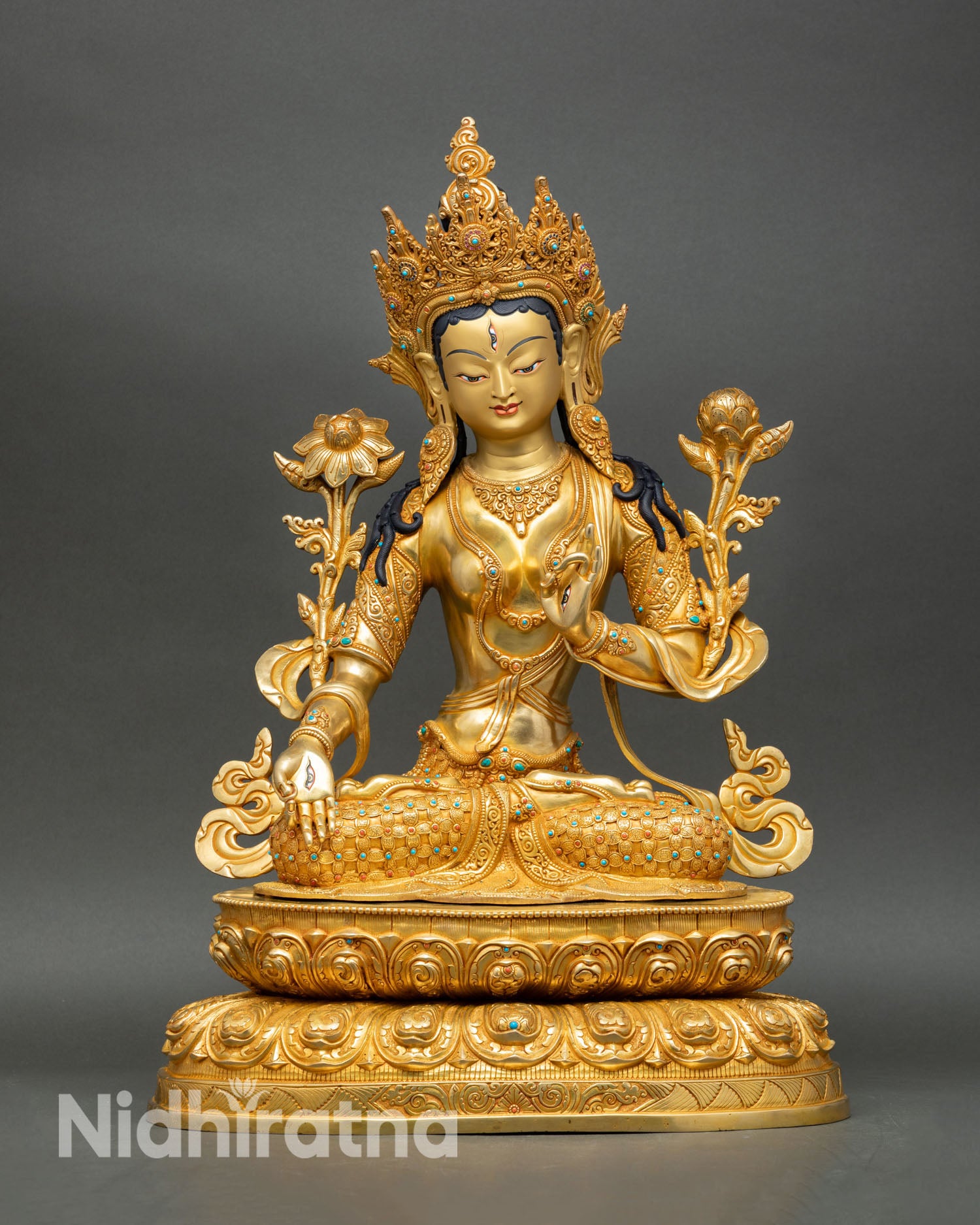Front view of White Tara statue handcrafted in Patan Nepal, copper with 24K gold fire gilding turquoise and coral stone embellishments