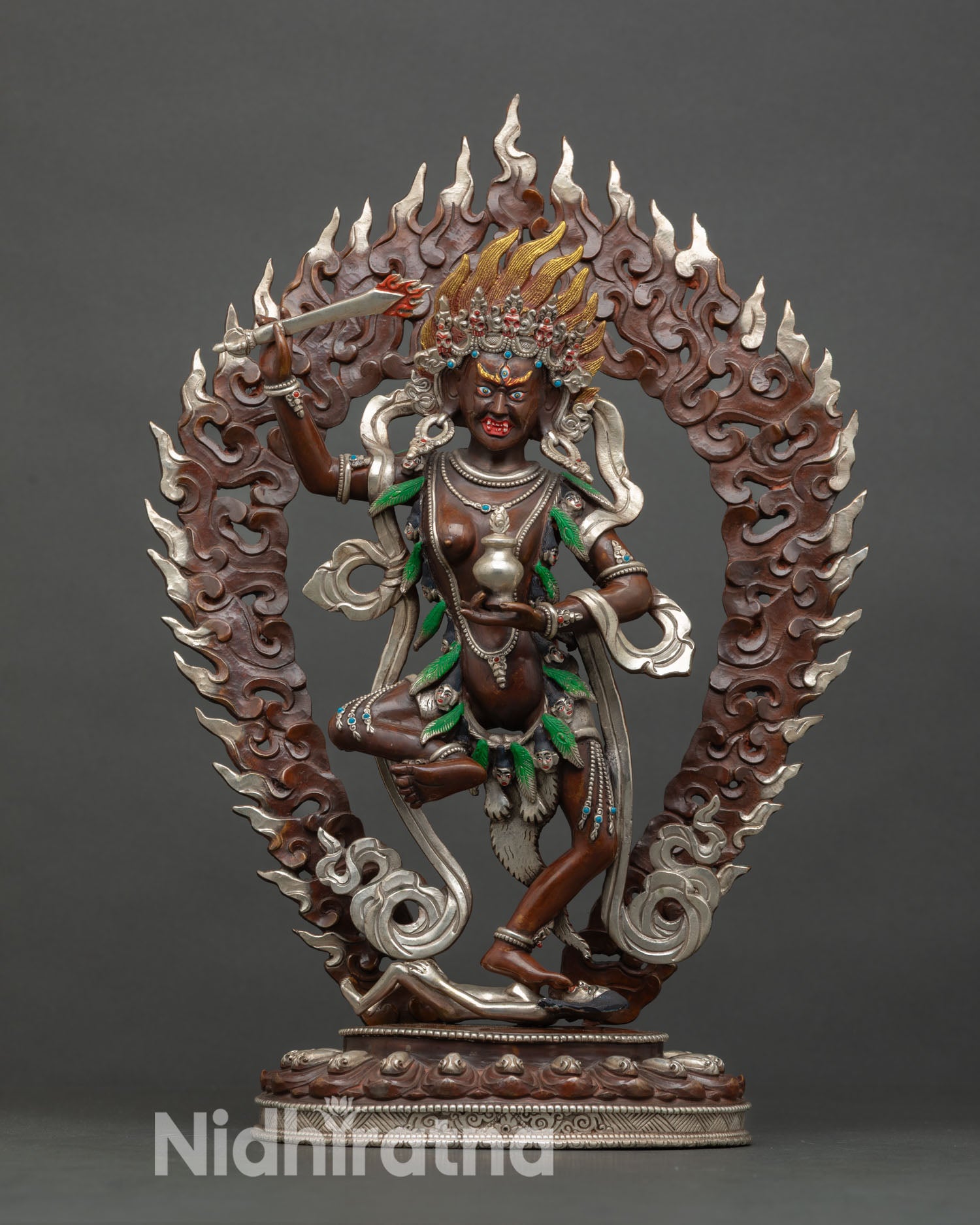 Front view of Yeshe Walmo wrathful Dharma protector statue Nepal copper oxidized silver plated altar decor.