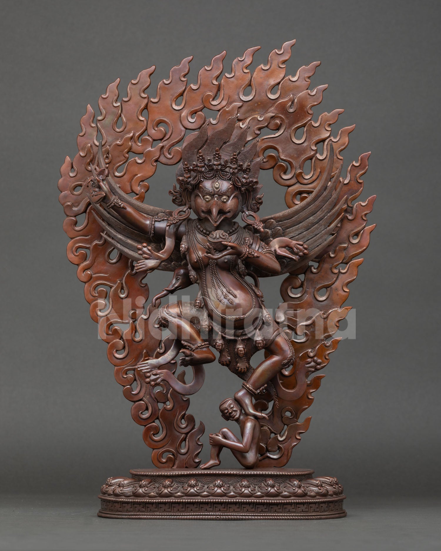 Front view of oxidized Garuda statue handcrafted in Nepal lost wax copper sculpture sacred guardian deity artwork