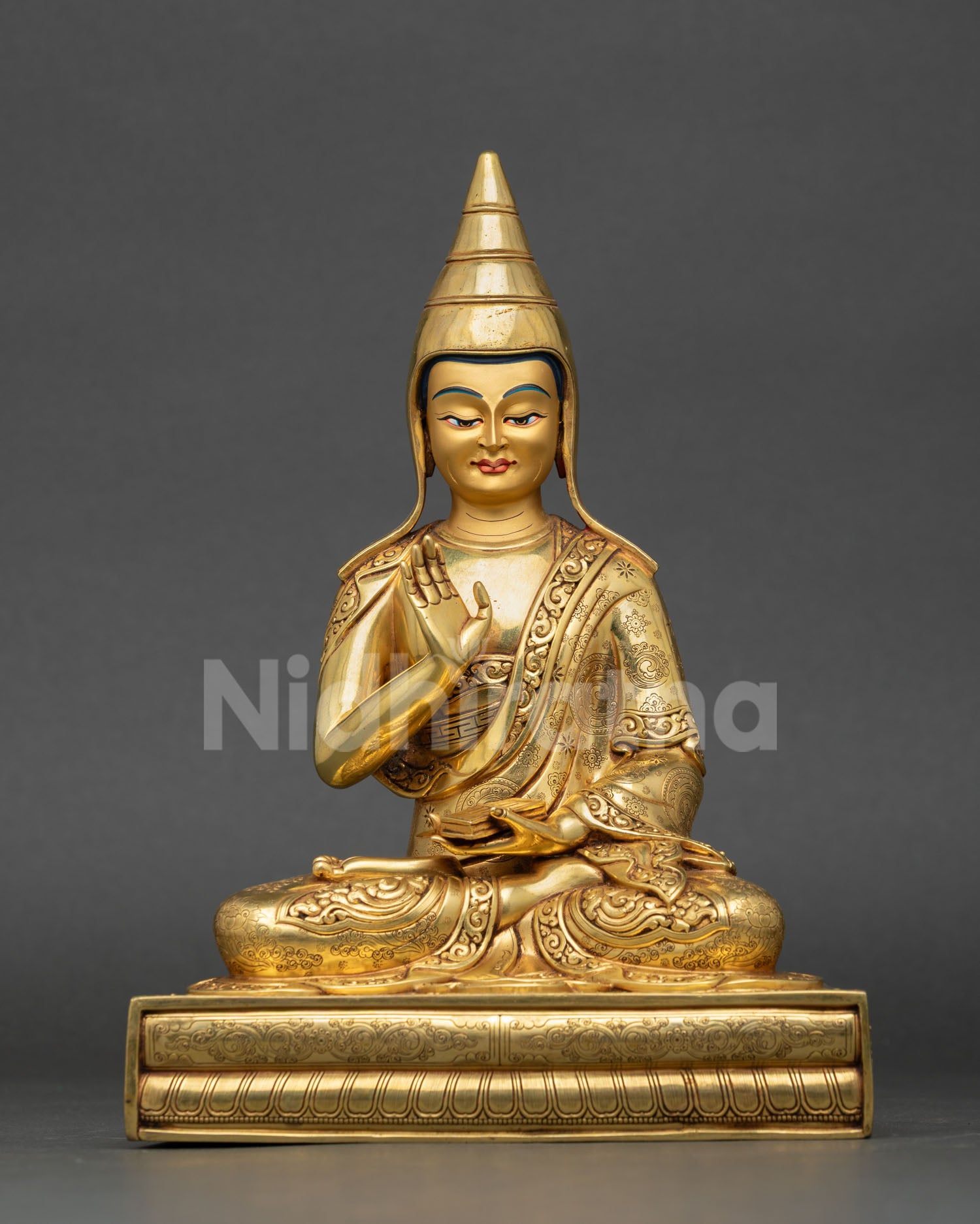Front view of Santaraksita statue handcrafted in Nepal copper with 24K gold gilding and serene gold finished face for Buddhist altar decor