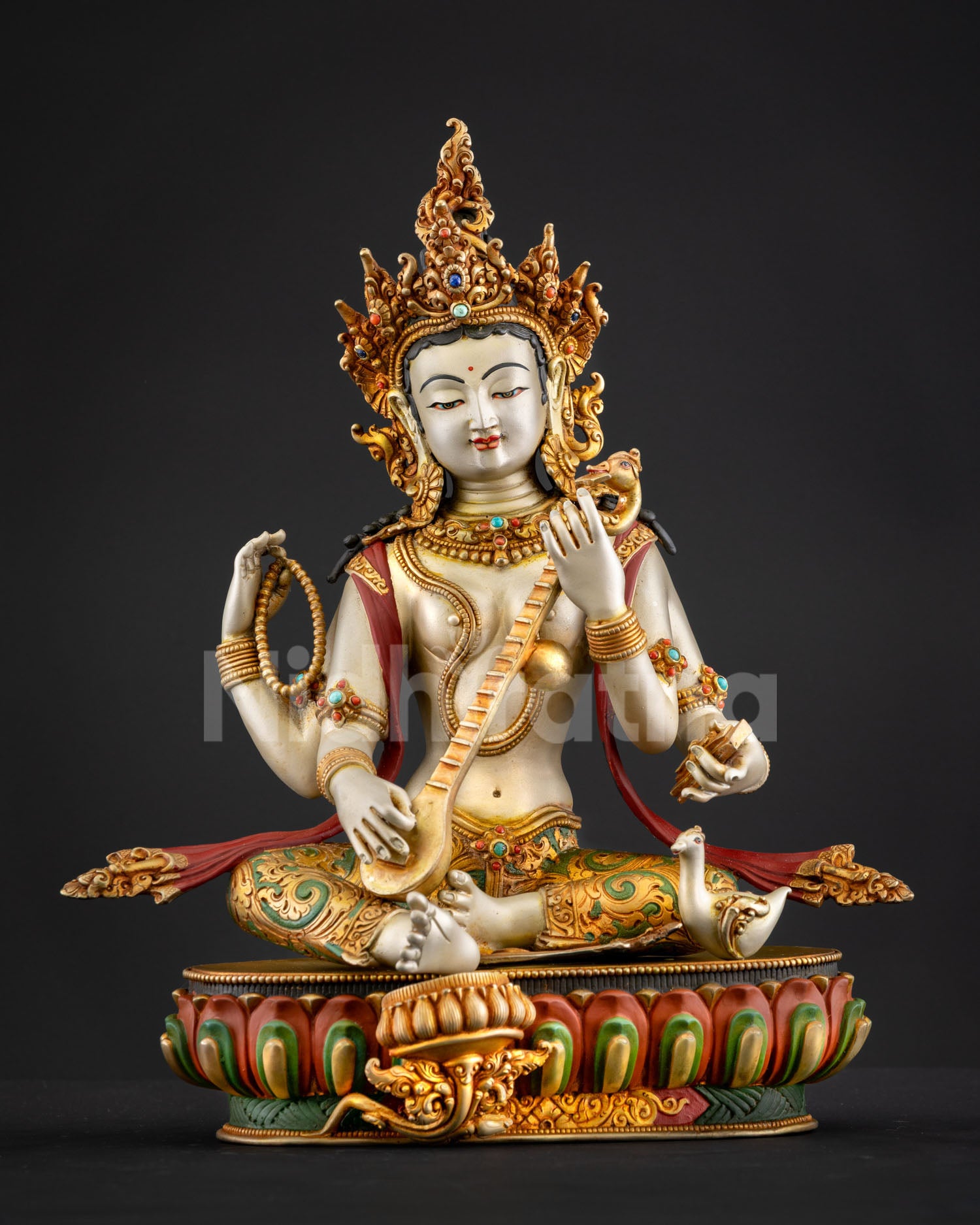 Front view Saraswati statue handcrafted Nepal lost wax casting white finish gold gilded details, sacred Hindu sculpture
