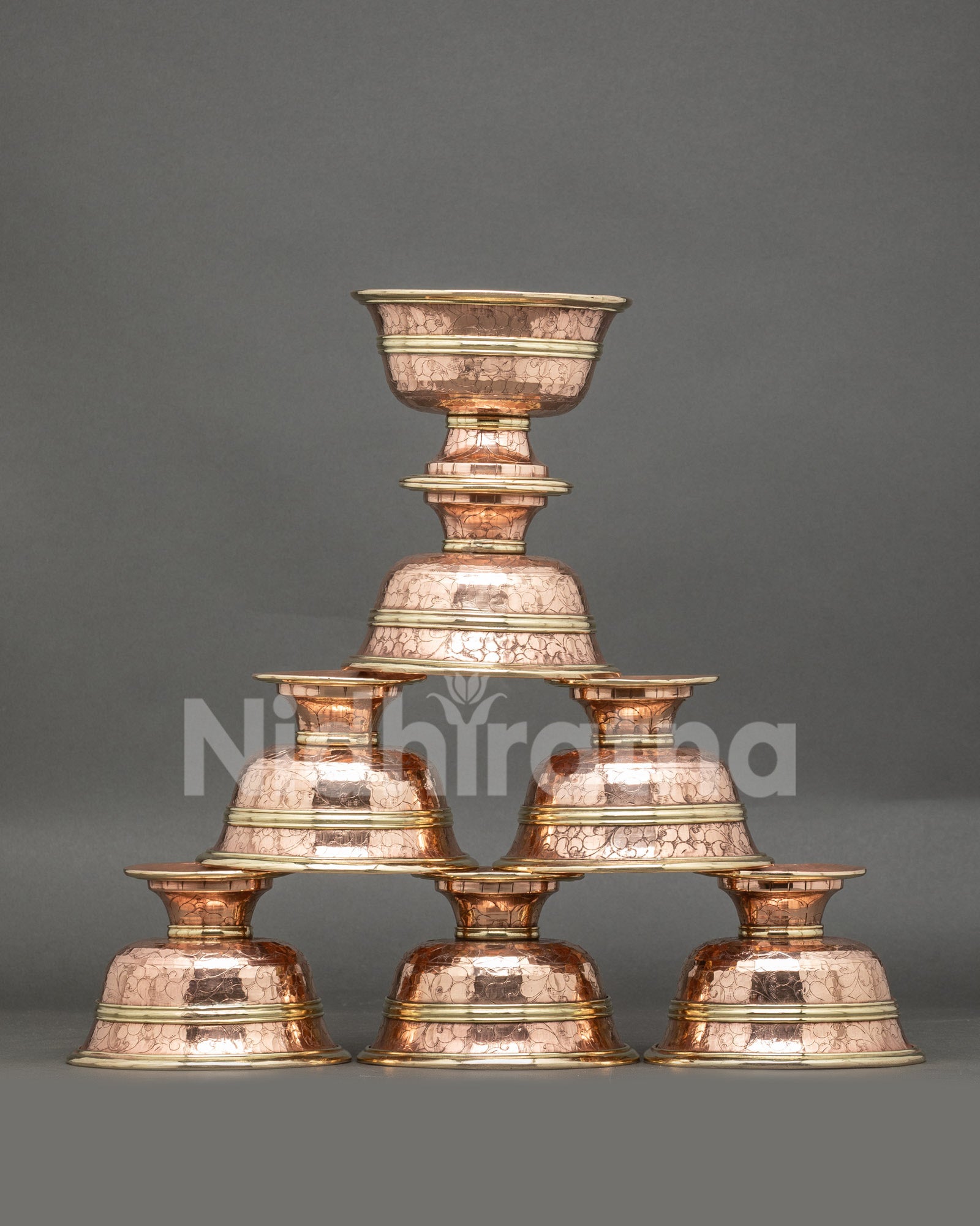 Front view seven water offering bowls handcrafted copper Tibetan altar set