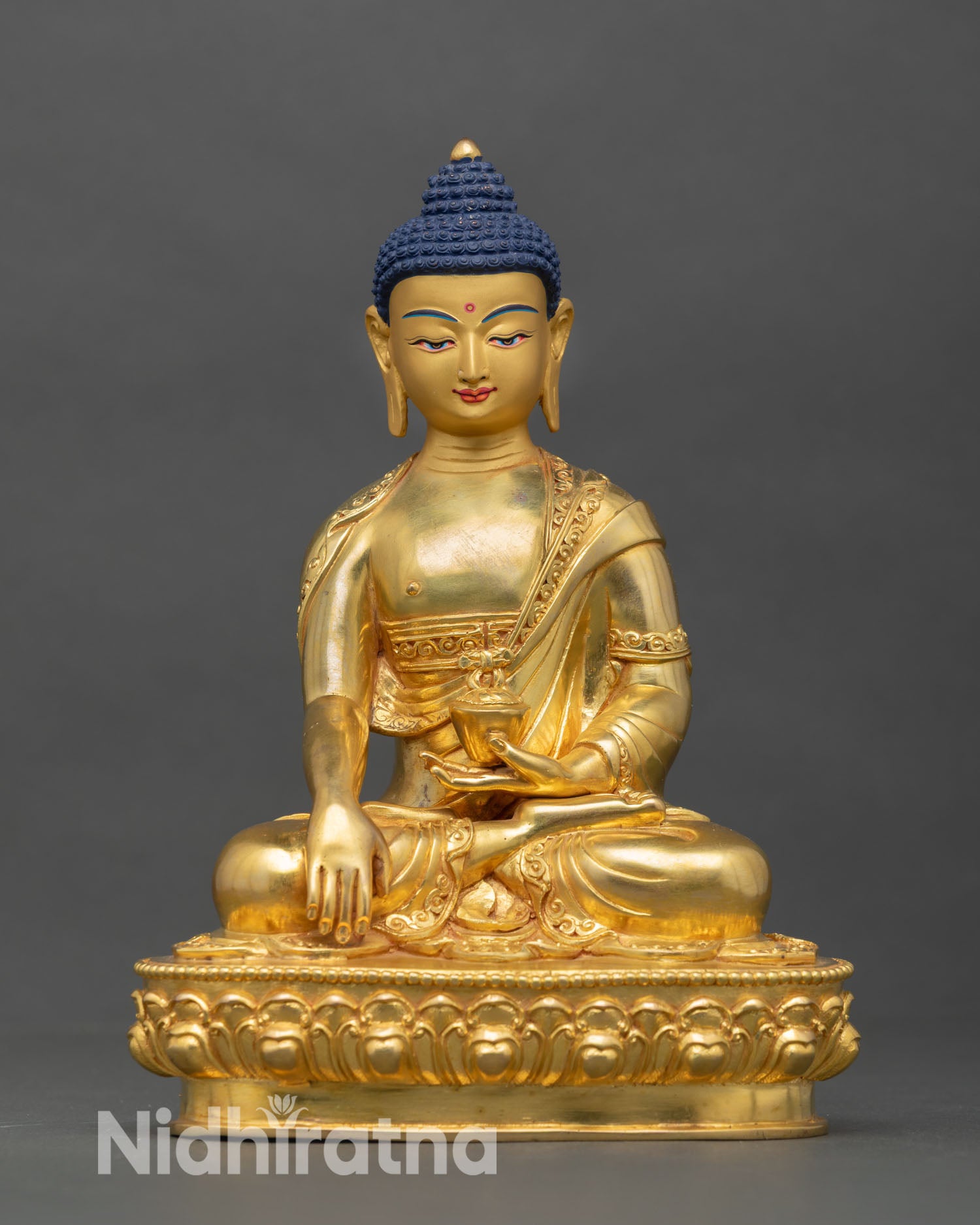 Front view of Shakyamuni Buddha statue copper gold gilded finish seated lotus pedestal earth touching mudra Nepal artisan sculpture