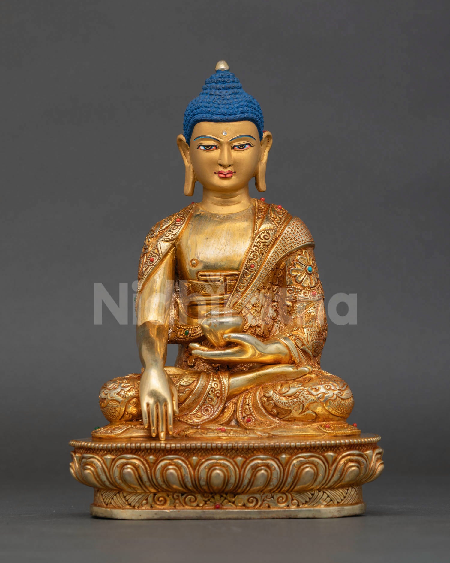 Front view of Shakyamuni Buddha statue handcrafted in Nepal copper with gold gilding for meditation altar and spiritual decor