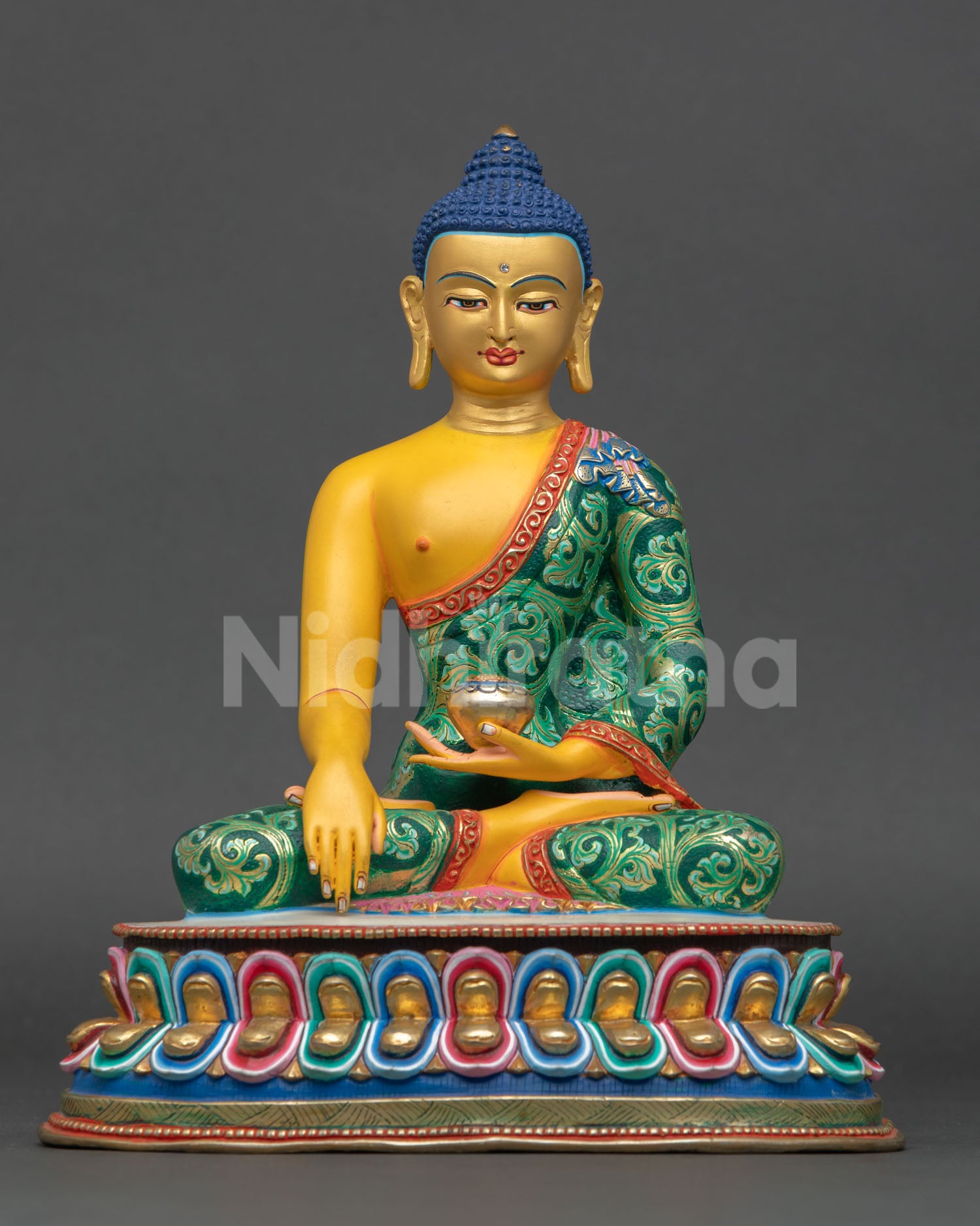 Front view of Shakyamuni Buddha statue handmade in Nepal by Newari artisans copper sculpture with yellow finish gold painted face