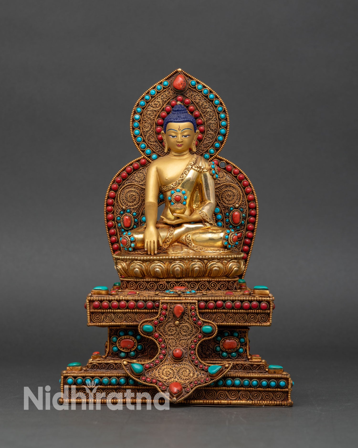 Front view of Shakyamuni Buddha statue ornate lotus throne copper sculpture 24K gold fire gilding Patan style Himalayan Buddhist sacred art