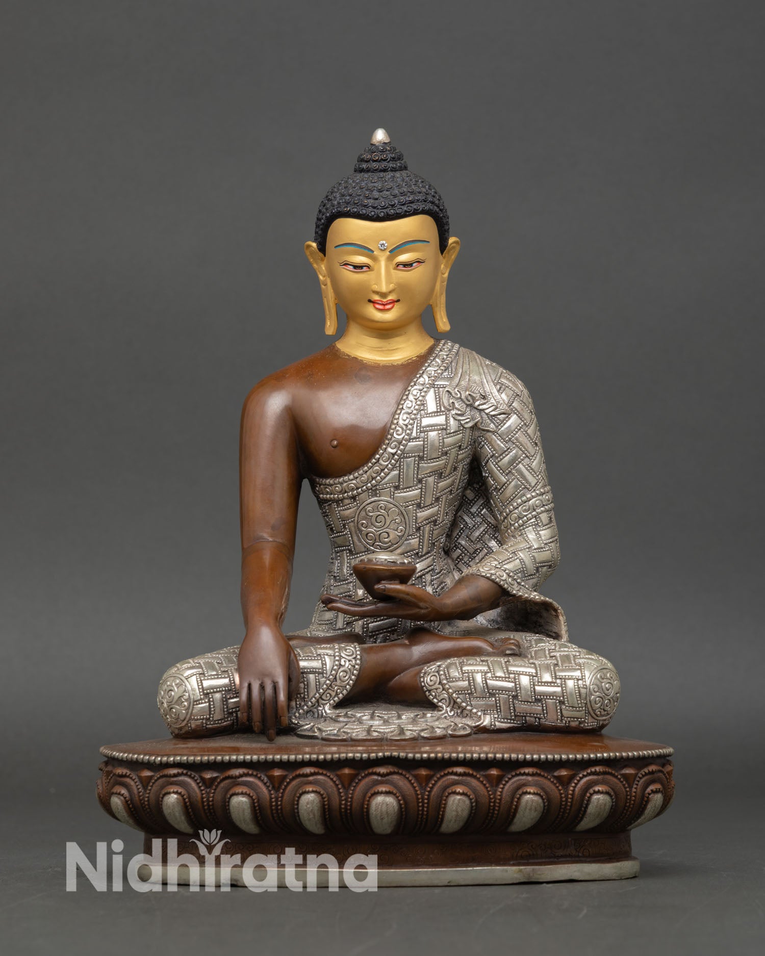 Front view of Shakyamuni Buddha statue oxidized silver plated copper lotus pedestal