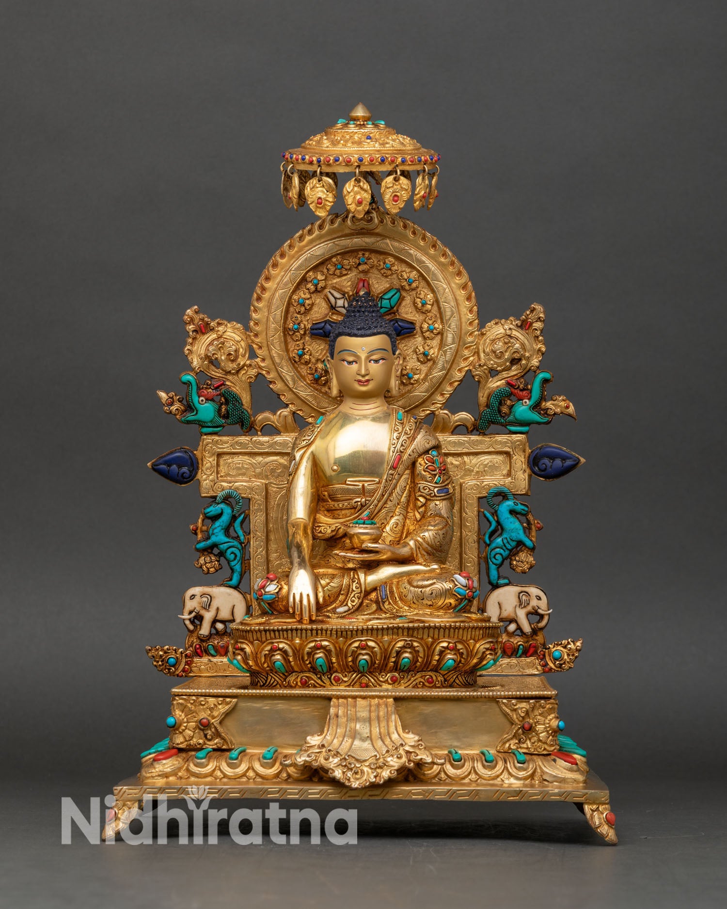 Front view of Shakyamuni Buddha statue seated on ornate throne copper sculpture Nepal lost wax casting