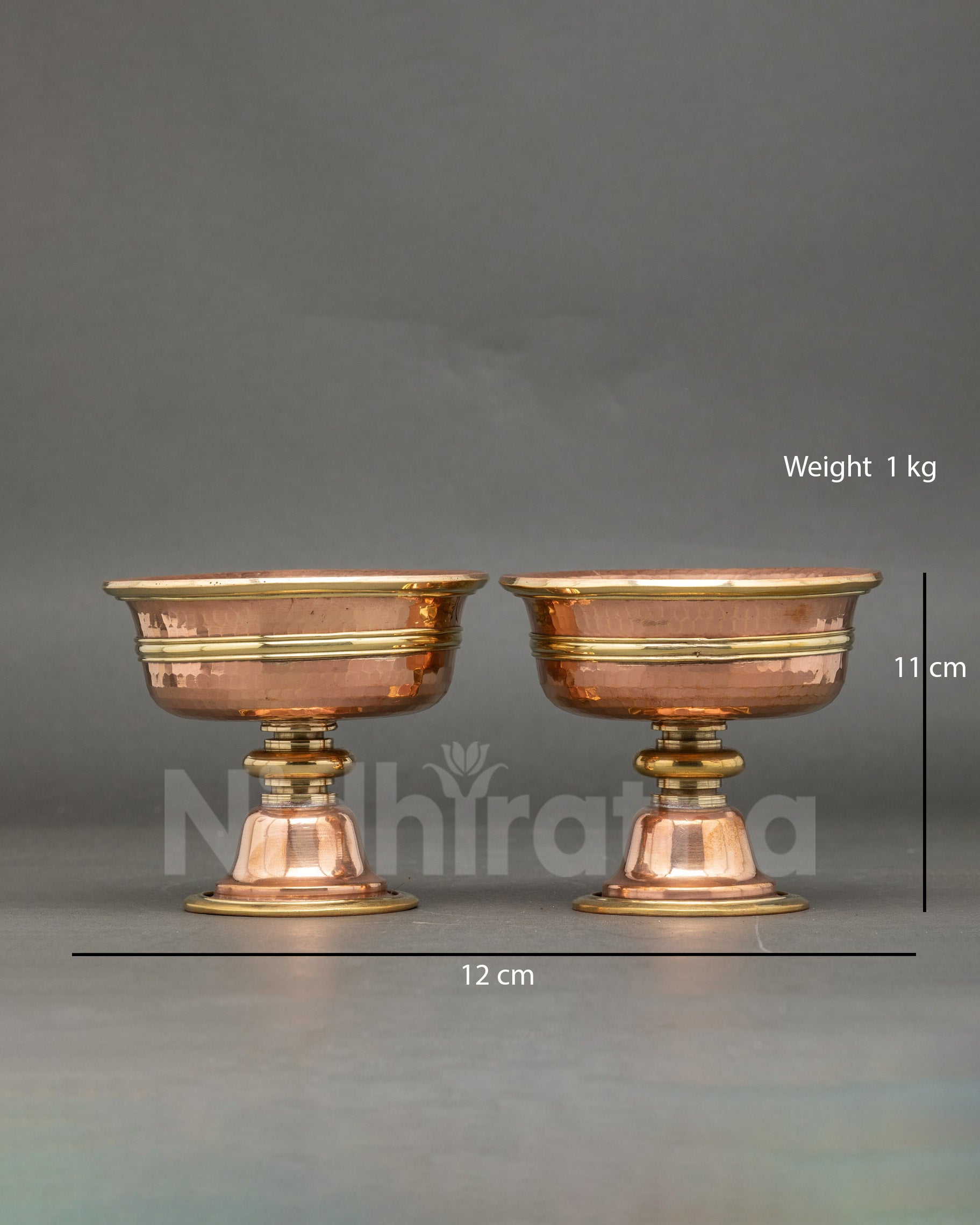 Front view small two butter lamps handcrafted copper Tibetan altar