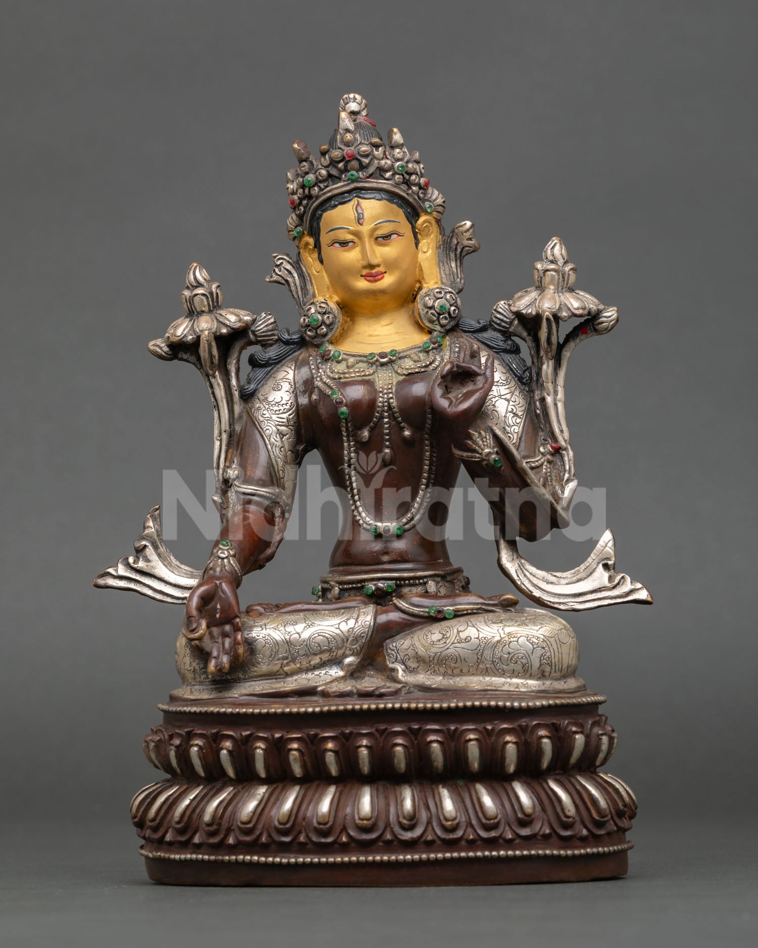 Front view of White Tara statue, gold painted face all seeing seven eyes Nepal Newari artisan Buddhist healing goddess sculpture