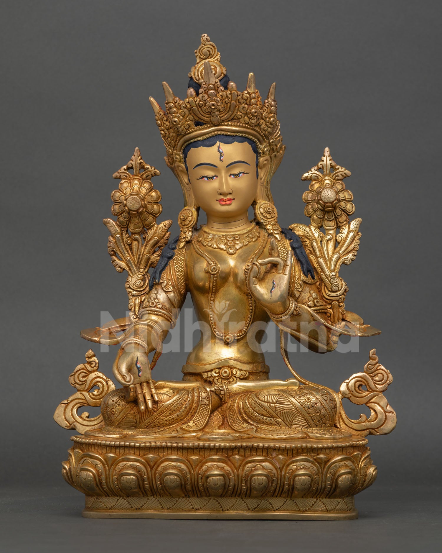 Front view of White Tara Statue, handmade by a Newari artist from Patan, Nepal, featuring a copper body gold-painted face, and lotus pedestal design