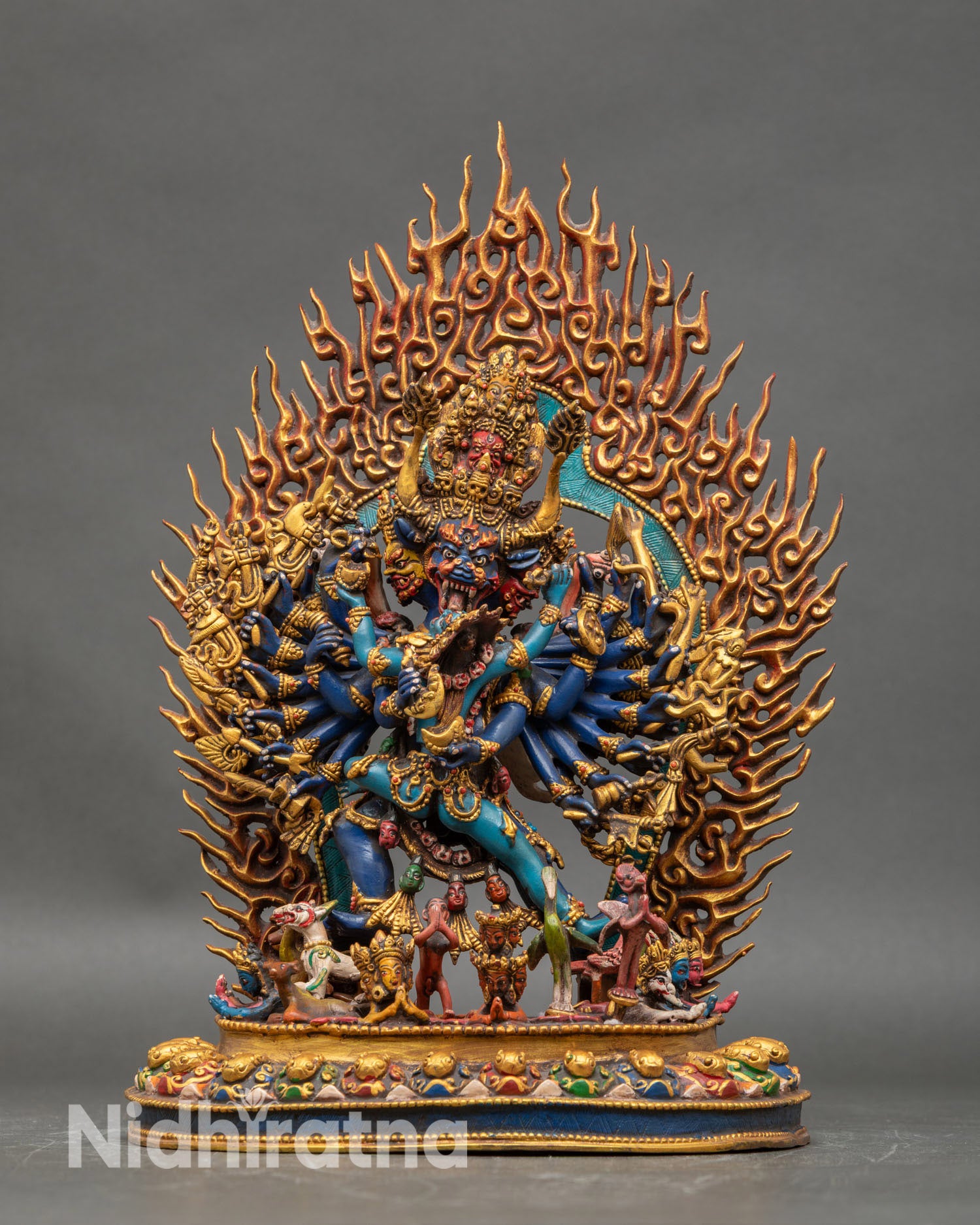 Front view of Yamantaka Consort statue nine faces sixteen arms handcrafted Nepalese copper acrylic colors lotus pedestal