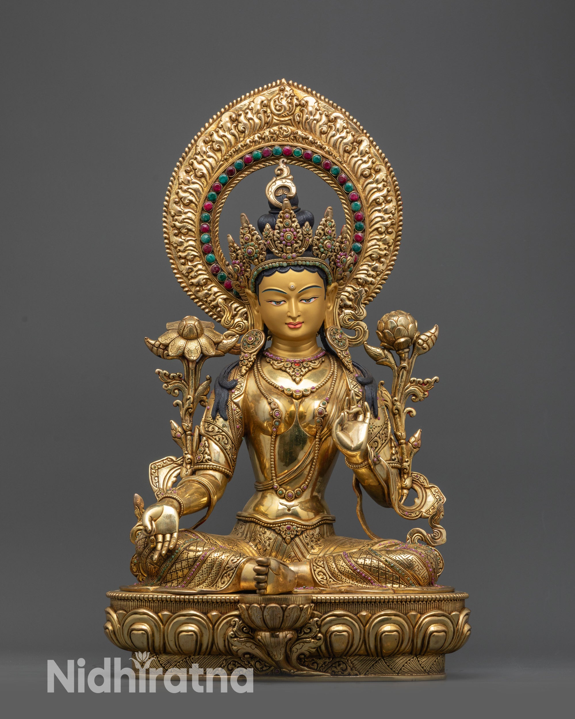 front view Green Tara statue on lotus base with crown, halo and blue lotus