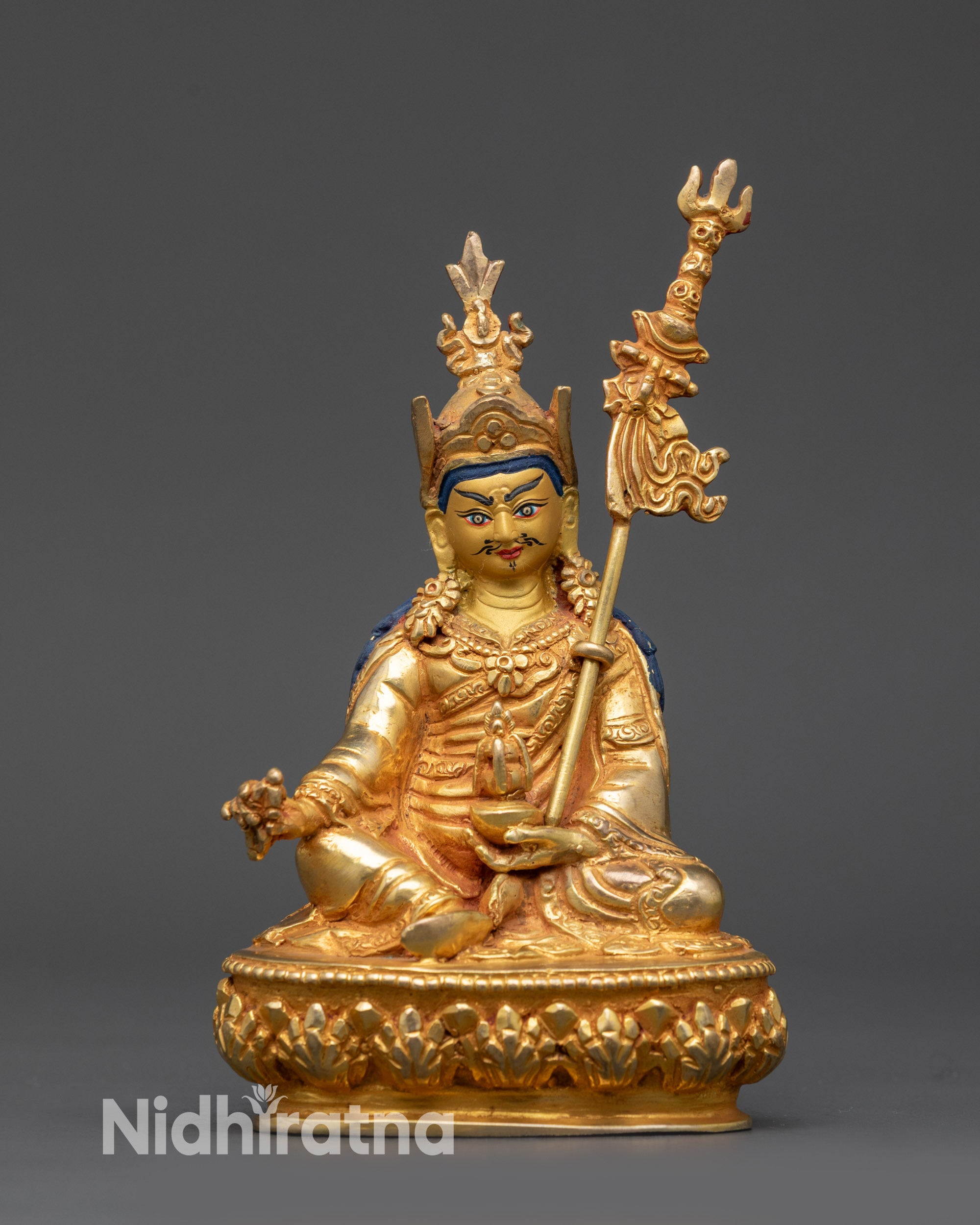 front view Guru Rinpoche Padmasambhava statue with vajra and skull cup details