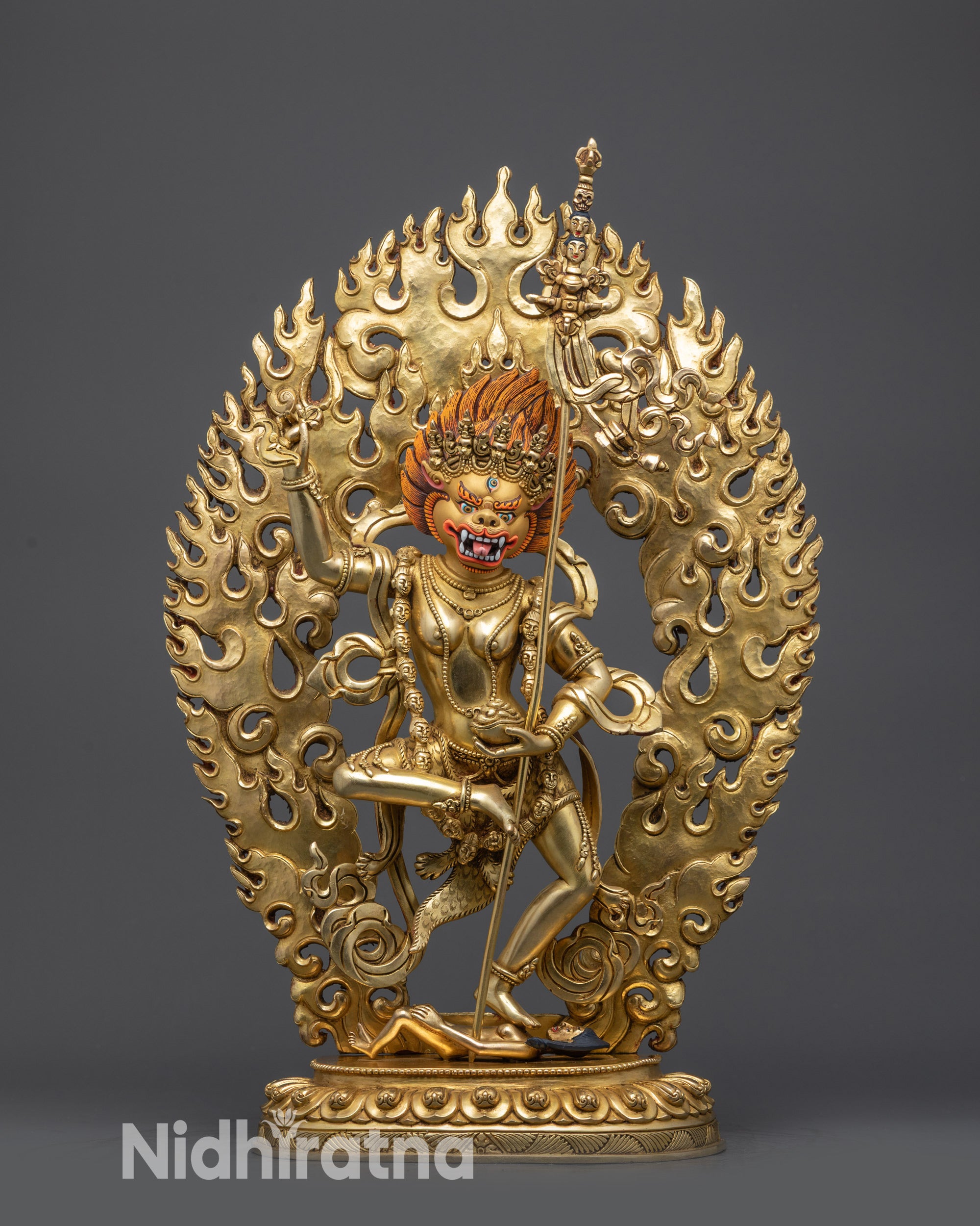 front view gold-gilded Simha Mukha statue with lotus base and blazing halo