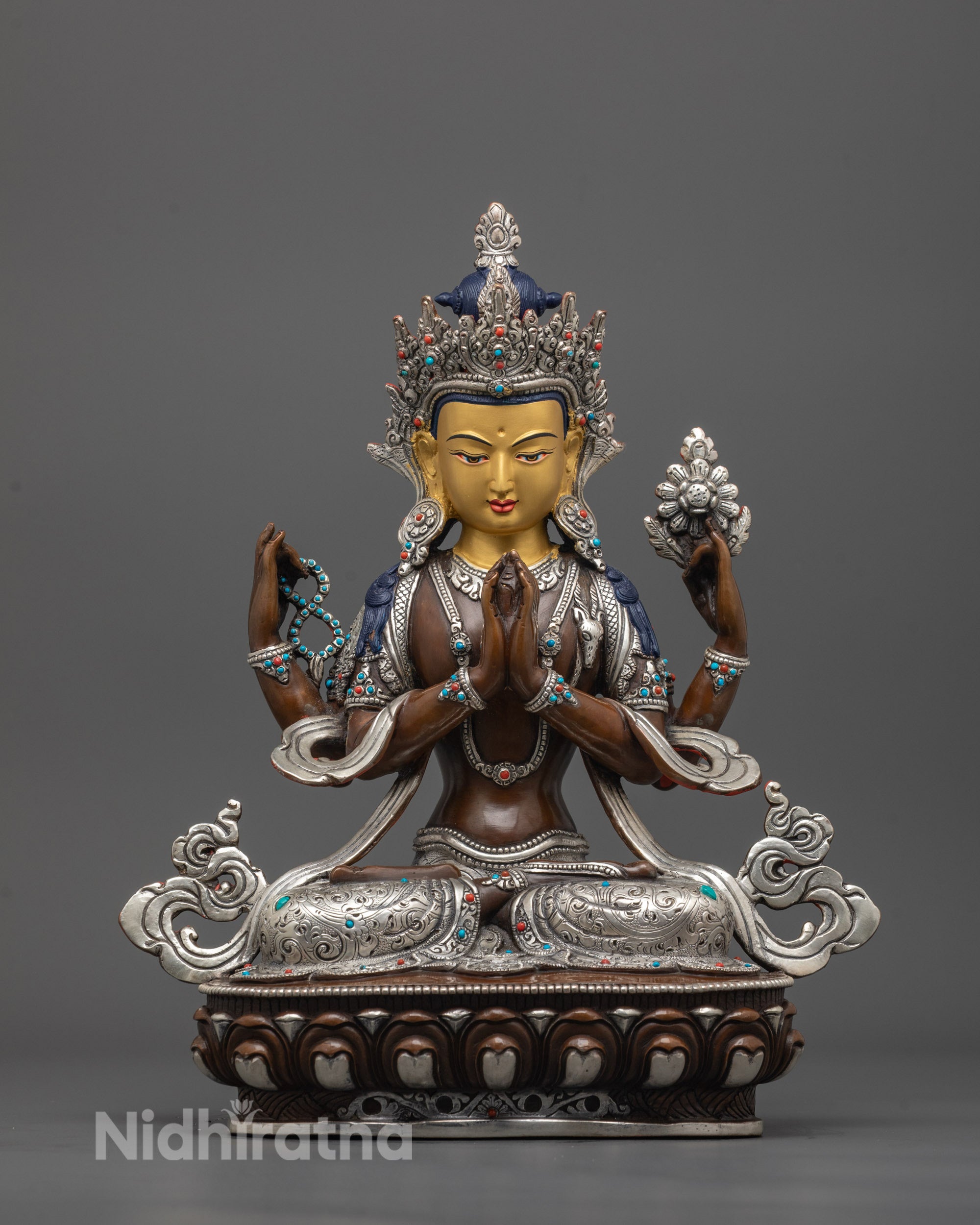 front view of Oxidized Chenrezig Statue with 24K gold-gilded face and lotus throne