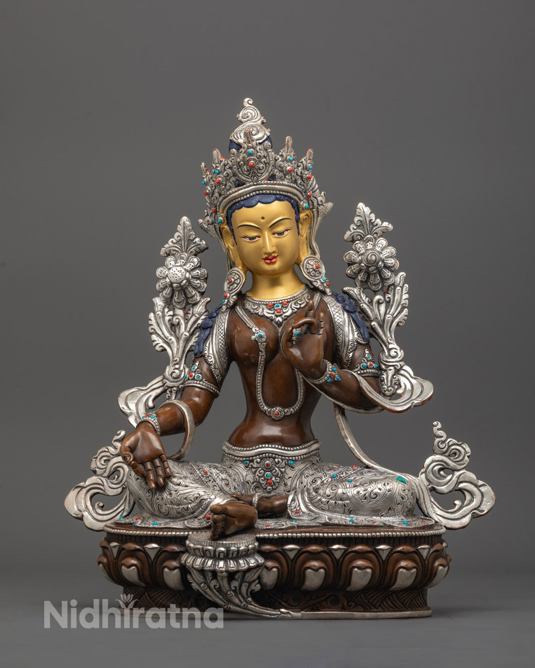 front view of Oxidized Green Tara Statue with 24K gold face and silver-plated lotus base