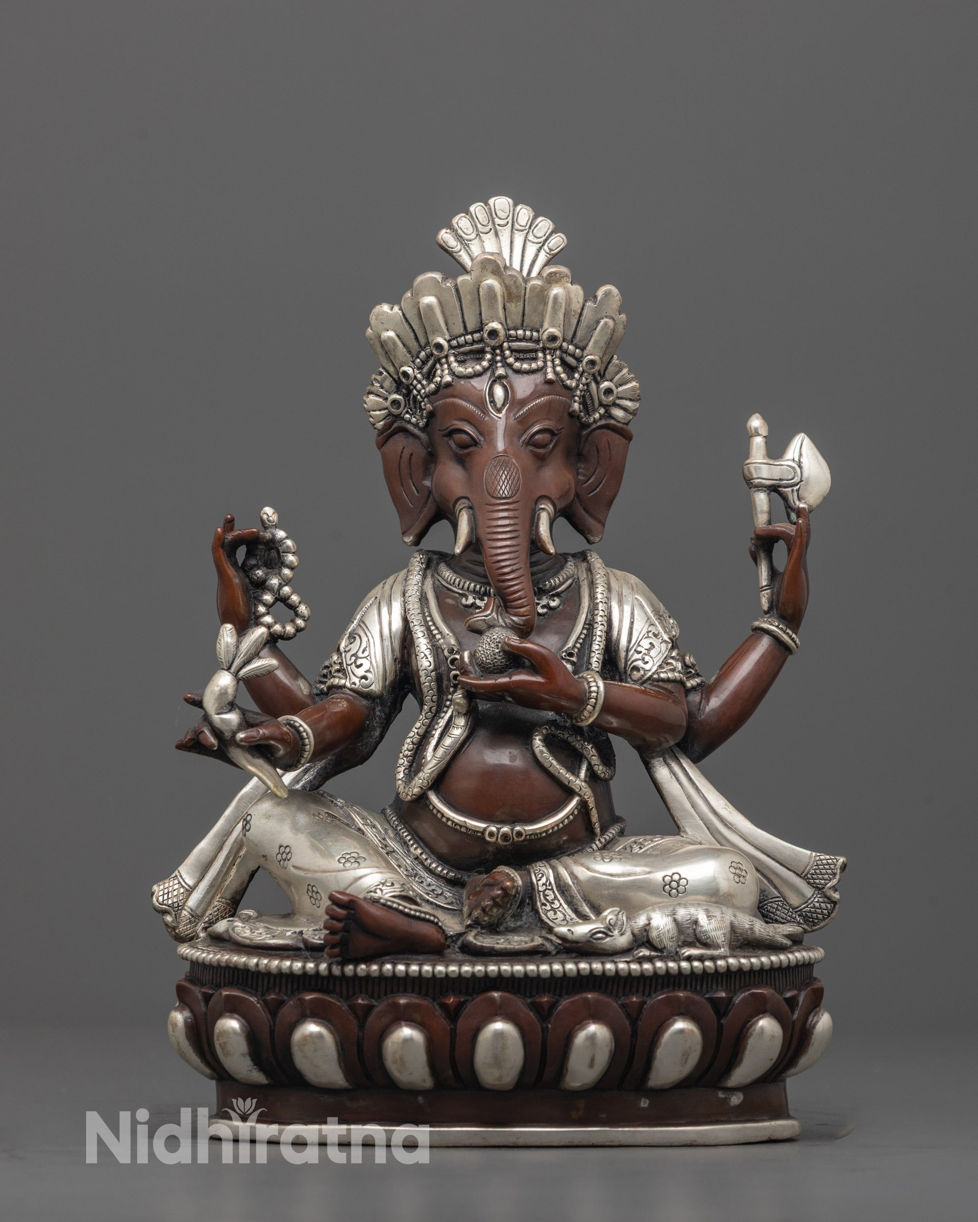 front view of exclusive lord ganesha statue with silver crown and lotus seat for home altars