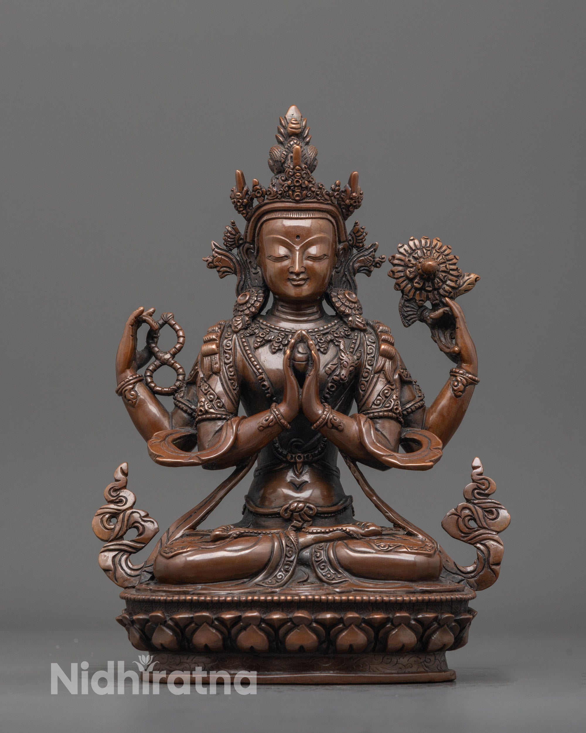 front view of handcrafted chenrezig statue with oxidized copper body from nepal