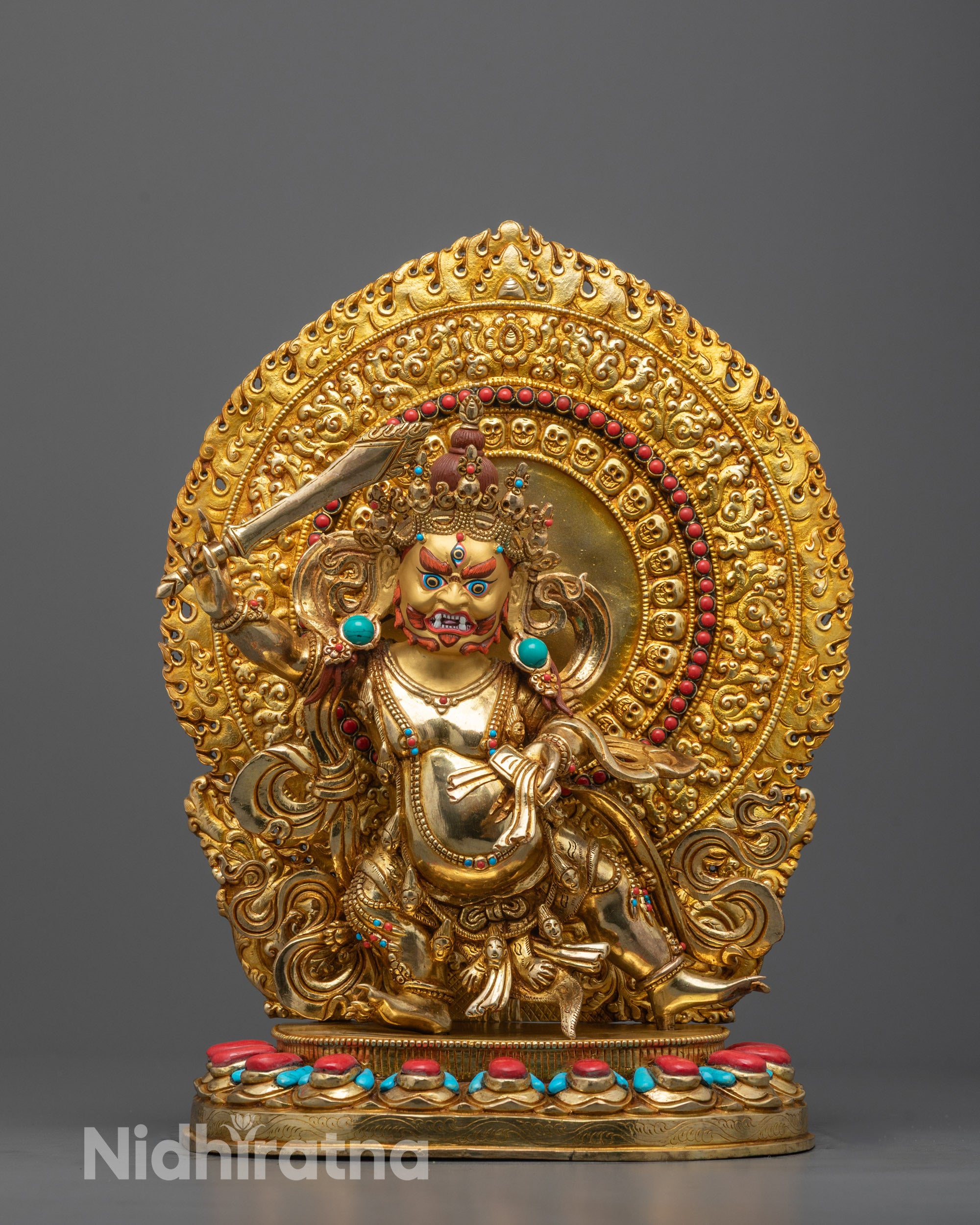 front view of handcrafted wrathful manjushri statue with gold gilded body and lotus base