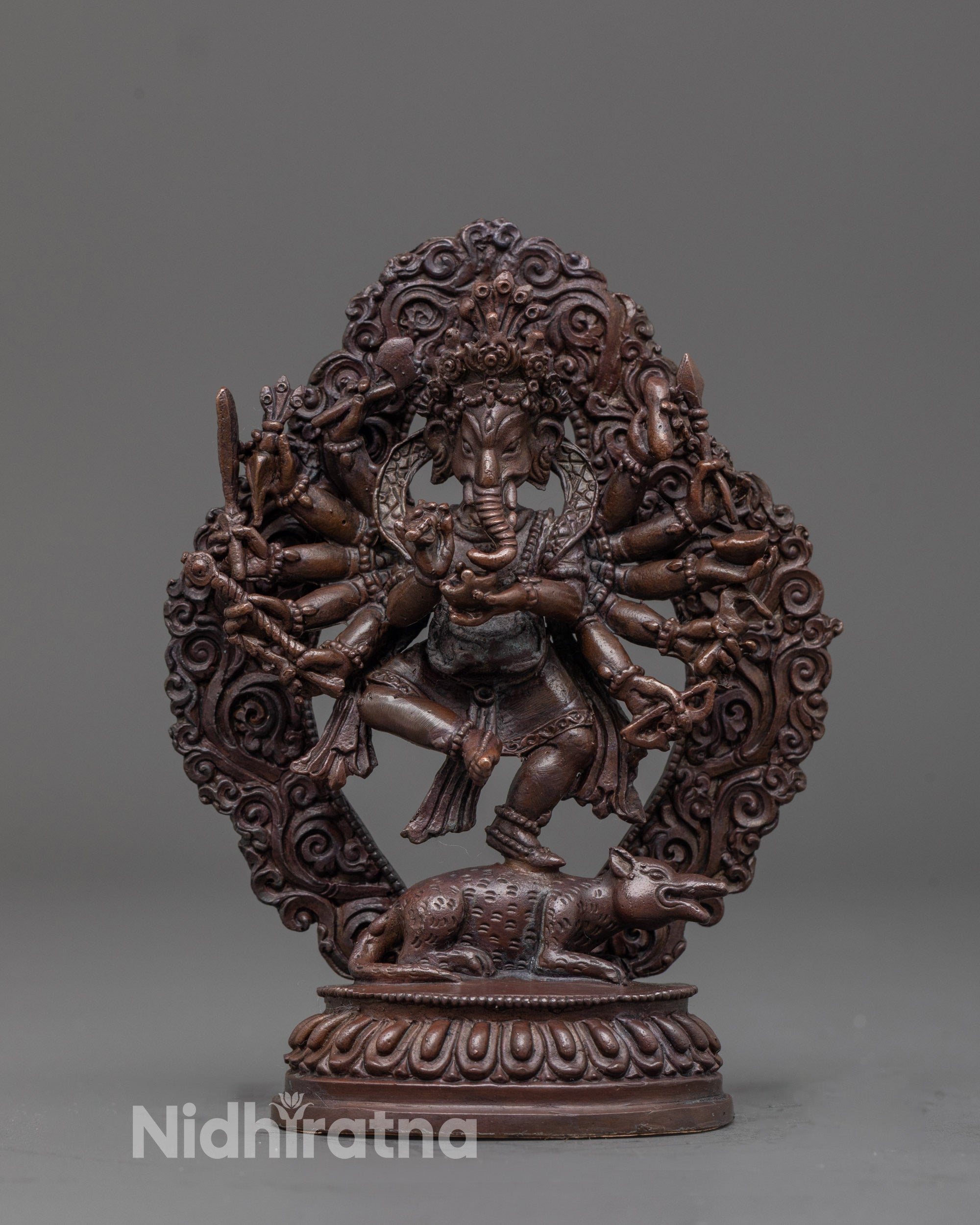 front view of oxidized Ganapati statue with six arms and detailed carvings on Mooshaka
