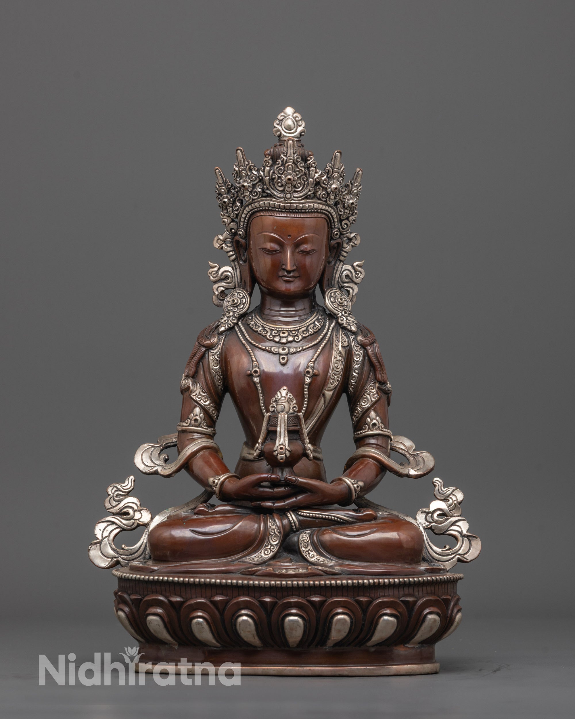 front view of oxidized amitayus buddha statue with silver-plated lotus seat and crown