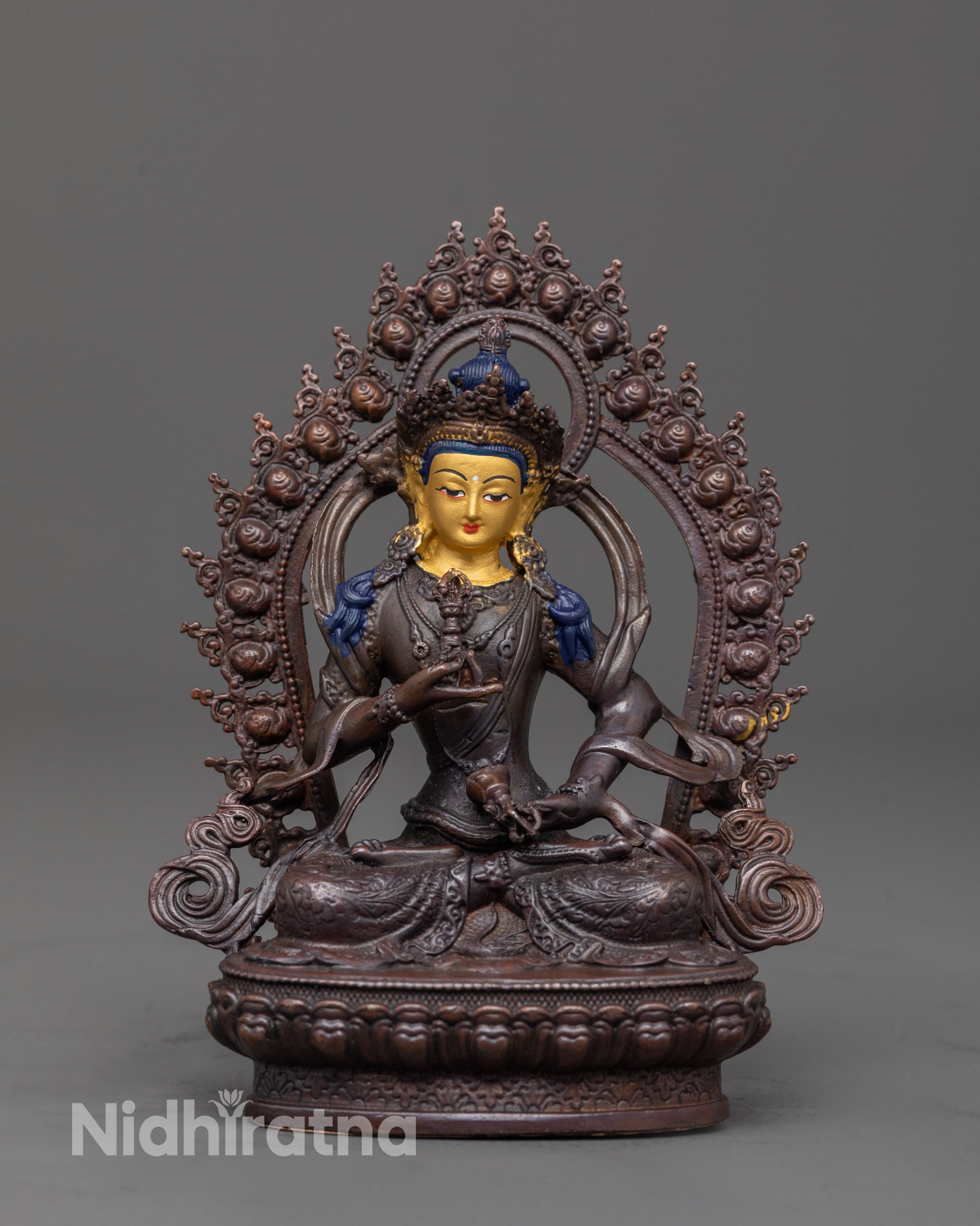 front view of precision crafted vajrasattva statue with gold face and oxidized copper body