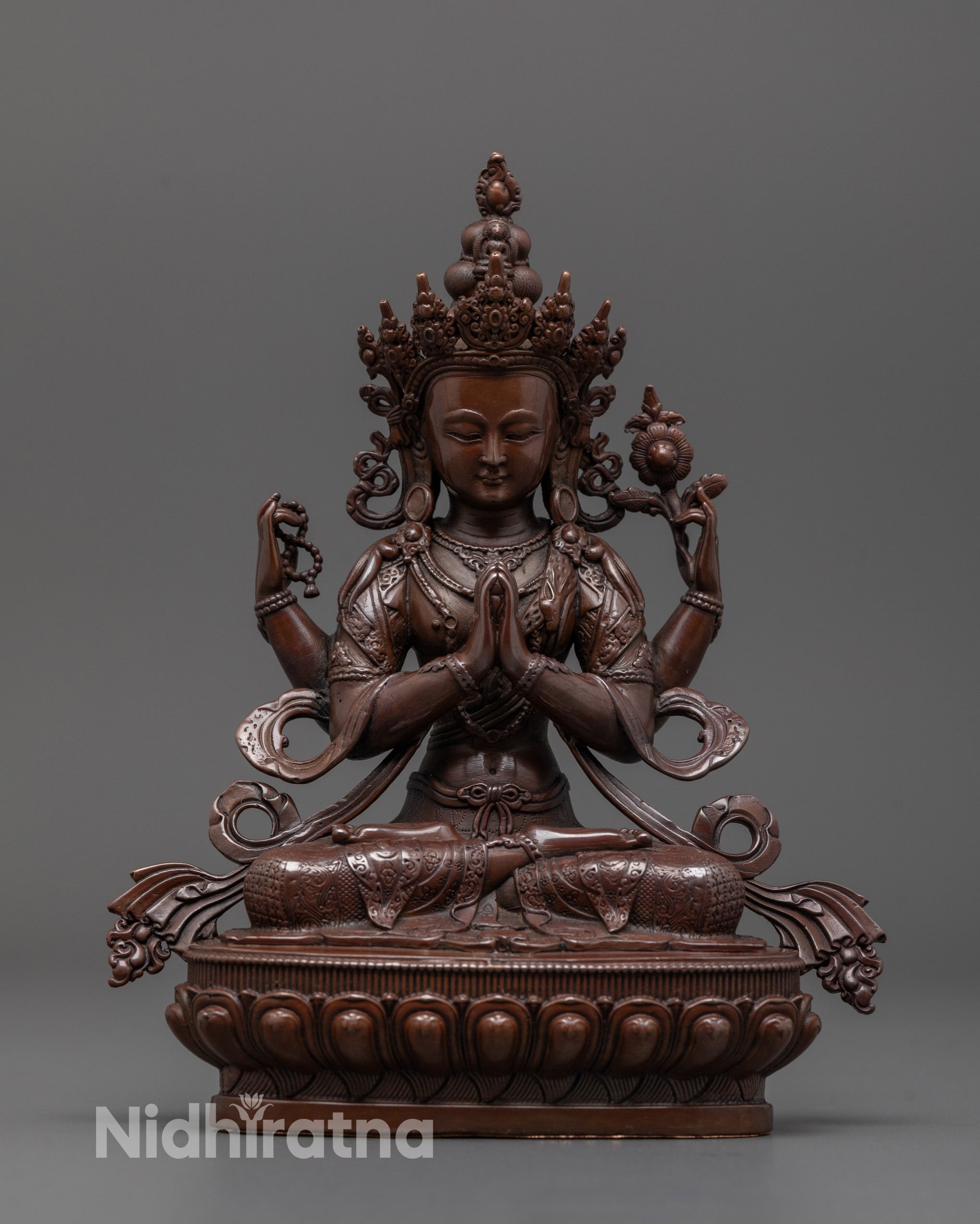 Front view of machine-made oxidized Chenrezig statue with detailed electroplated finish
