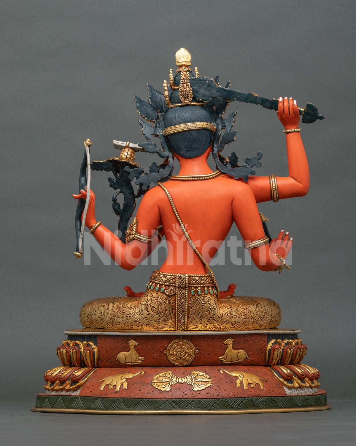 Full back view of handcrafted Maha Manjushri statue with patinated halo and gold-gilded lotus base